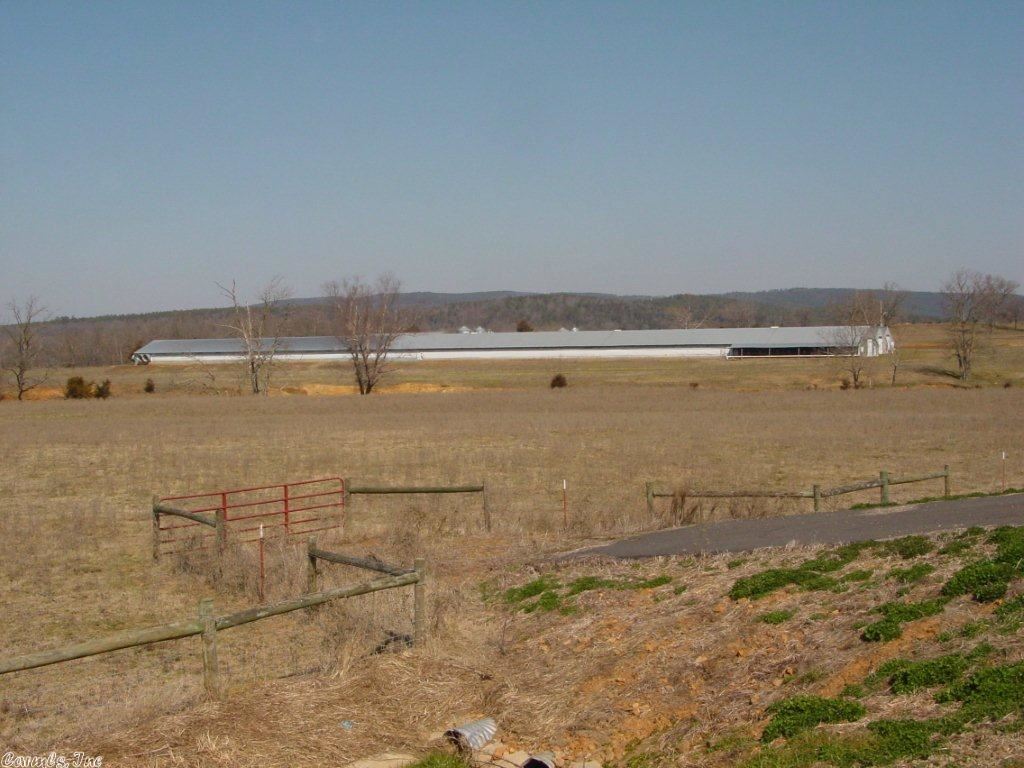 FIVE GENERATIONS OF FARMERS HAVE CALLED THIS HOME Approximately 280 acres of pristine farmland with over a mile of Illinois Bayou frontage. 3-Chicken Houses less than 10 years old computerized with generators. Litter Shed, Huge Hay Barn, 3 Dwellings 1-2300 sq ft, 1-2100 sq ft, and 1-800 sq ft. Every piece of equipment that you will ever need to take care of the entire farm all will convey with the right offer. We have tractors, loaders, backhoes, dozers, dumptrucks, bushogs, mowers, litter spreaders, disk,