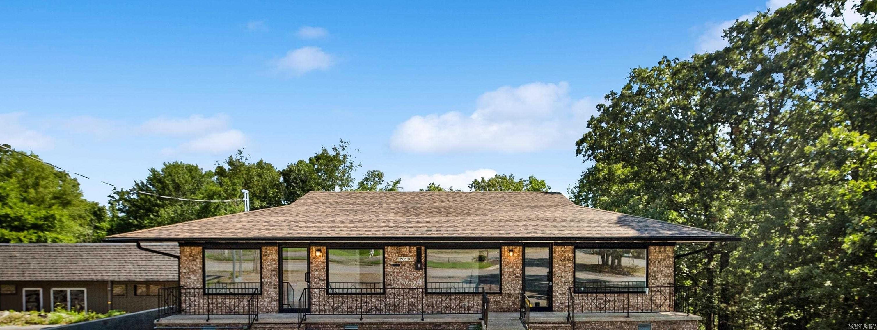 Located near Indian Hills is a fully renovated commercial brick building with a spacious parking lot. Renovation supports various business requirements.