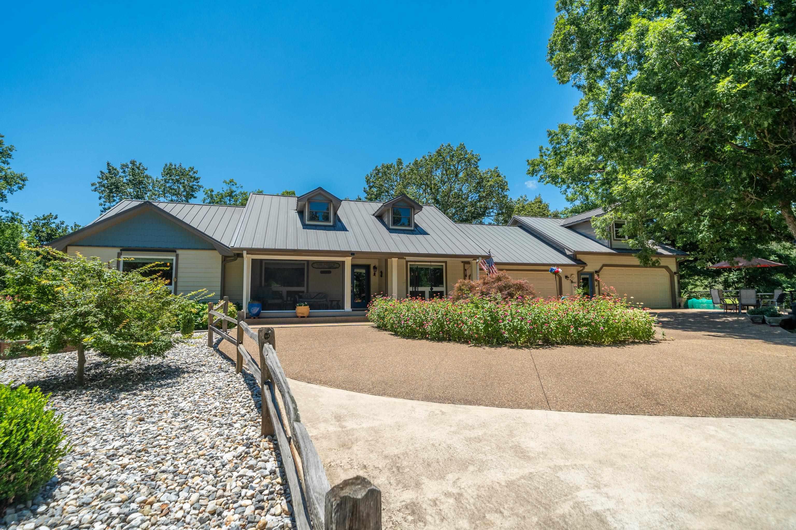 The Amazing Private Oasis you've been searching for Up On The Hill with the Breeze that is outside of town but with amazing neighbors not too far away where you can launch your boat right across the street, keep your horses, raise your chickens & tend your garden all in one quiet spot just under 7 Acres! You are 10 minutes away from Garvan Gardens or Lake Catherine State Park or Diamondhead Golf Course too. When you are ready for home though, this well constructed and meticulously maintained property with lots of upgraded materials & features both inside & out creates the relaxing atmosphere we all crave. Did we mention a 4 car garage!?! Above one of the double garages is a fully contained apartment with private entrance on a separate HVAC system with plenty of room for a bed & dresser, couch, breakfast table, kitchenette, & a full bath! Off the Garage Area, There is a Screened In Porch with several uses, a mechanical room with half bath, plus another room that could be used many ways too. Your Front Porch features one side with automatic screens that seals out any mosquitos! The Huge Back Patio features a beautiful Gazebo housing a 2019 Swim Spa that's 14x8! Ahhhhhhh...just relax.