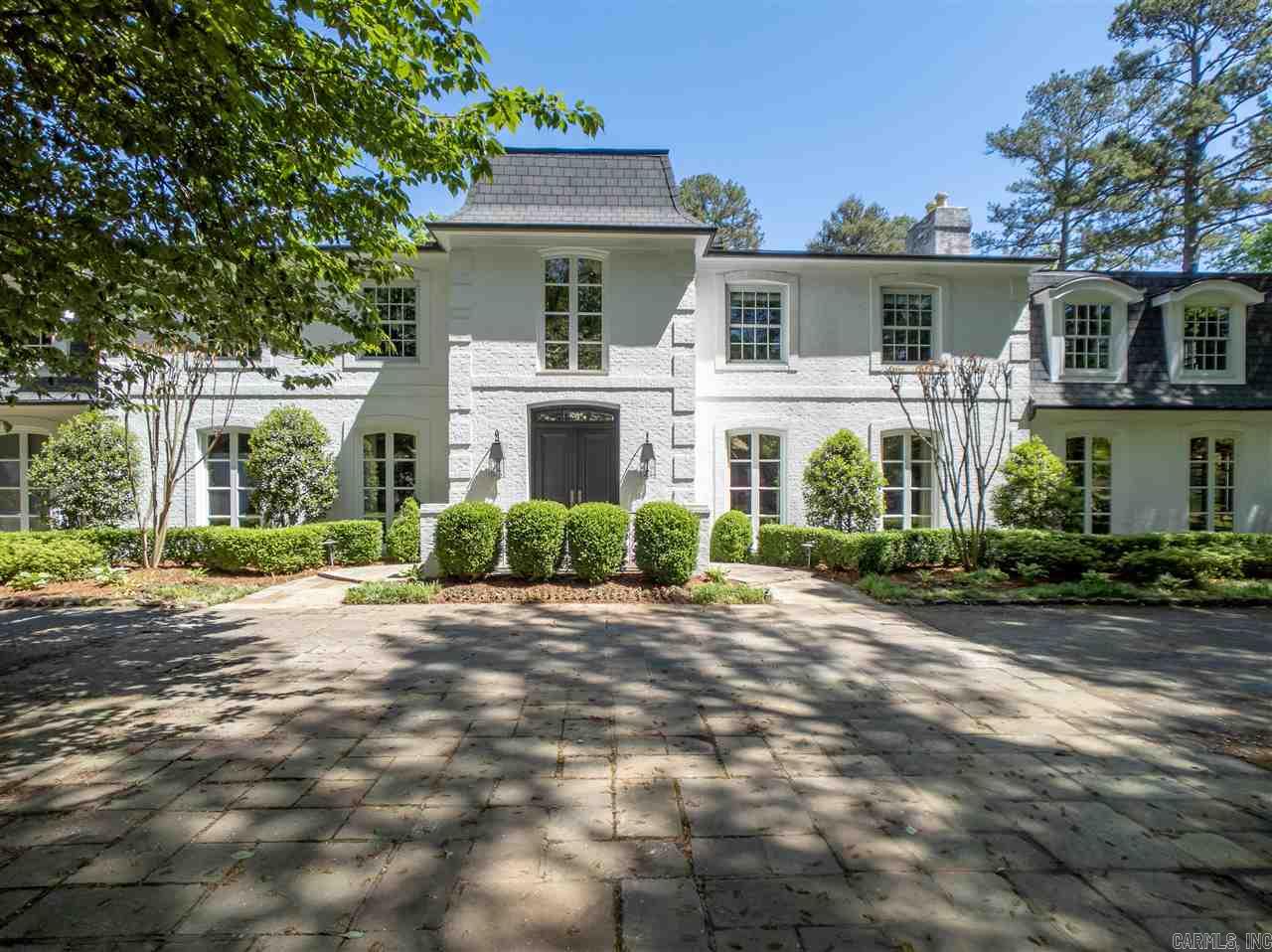 Style & grace are showcased in this beautiful updated estate. Open the door to curved staircase & large entry. Private oasis, surrounded by woods, no exposure to neighbors. Beautiful pool & wonderful outdoor spaces for entertaining. Kitchen showcases professional chef's quality appliances & large wine fridge. House circles around courtyard with views from kitchen/den & master suite. 5 bedrooms, 41/2 baths in main house & guest house which is 1309 sf See docs for complete improvements, floor plan & survey.