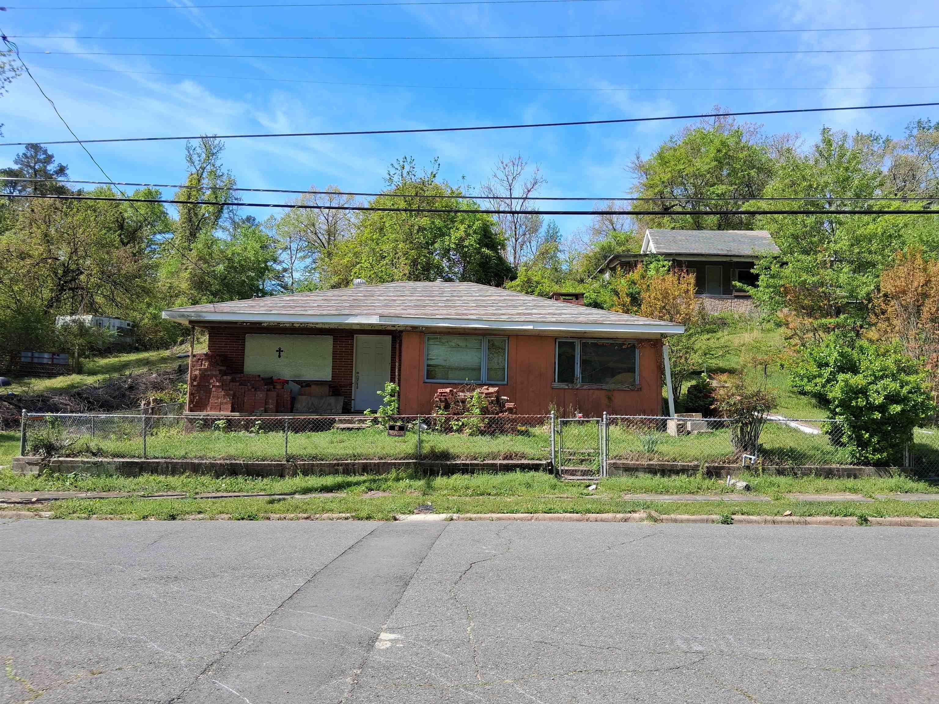 Investment property which means AS-IS. Some rehab work has been done. All building materials will be left to help new owner with rehab. Seller is only responsible for his tools that are in the garage. Minutes from downtown, hiking trails and stores. If purchased with property 421 Holly St. total list price is 130k. 421 Holley St. is listed for 65K
