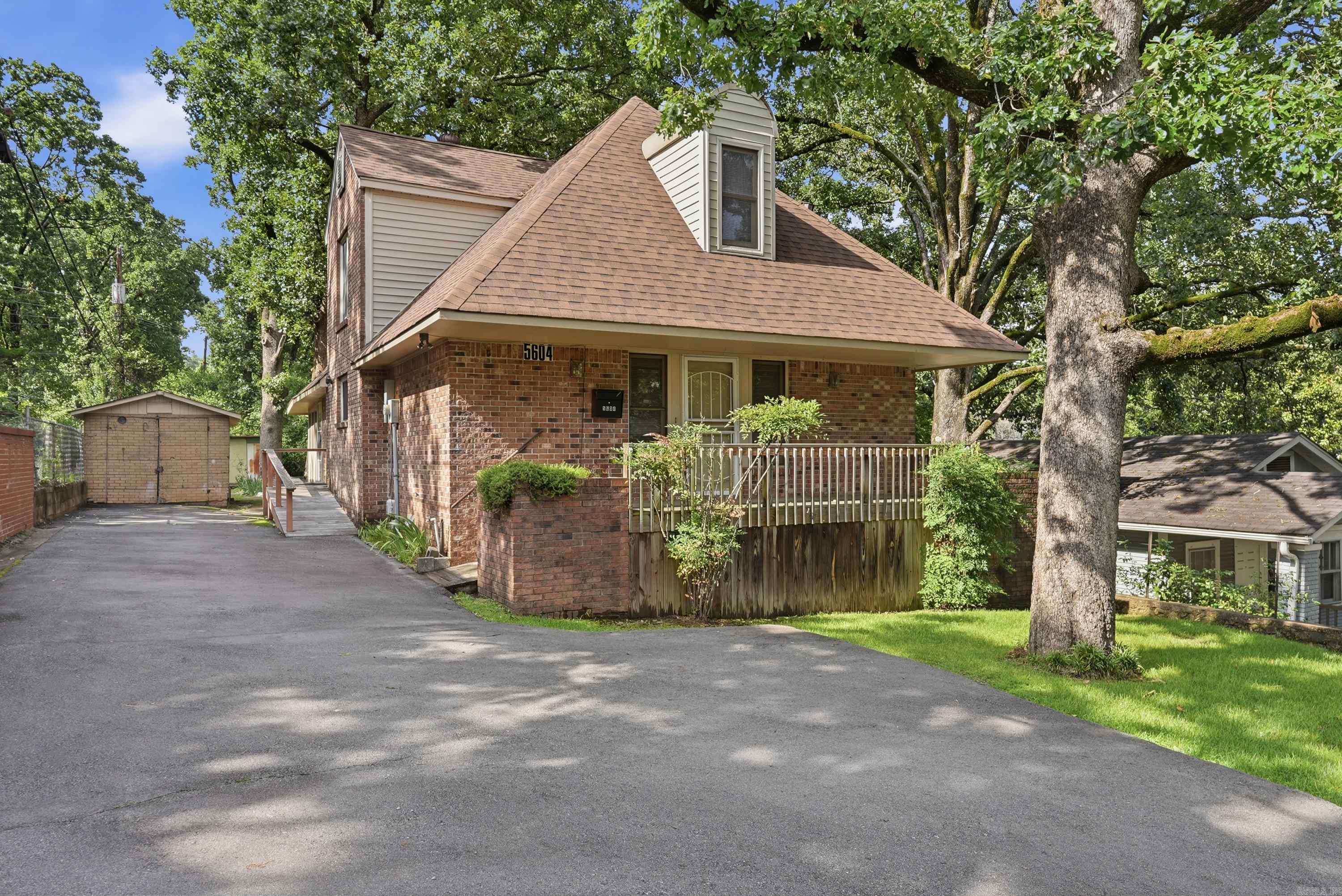 Located in Little Rock's beloved Hillcrest neighborhood, this four bedroom home is full of potential and ready for its next chapter. The primary suite sits on the main level, along with a large half bath for guests, a laundry room with shelving and counter space, a combined living and dining area, and interior access to the basement workshop. Upstairs offers a flexible layout that works as two bedrooms and a bonus room or three bedrooms, plus a hallway bath full of natural light and an adorable window seat. Lovingly cared for over the years and ready for a cosmetic refresh, it is a rare chance to add value in one of the city's most sought after neighborhoods. Walk to Holy Souls and Forest Heights STEM, with favorite Hillcrest shops and dining just minutes away. Kitchen refrigerator conveys! Come see it for yourself and schedule your showing today!