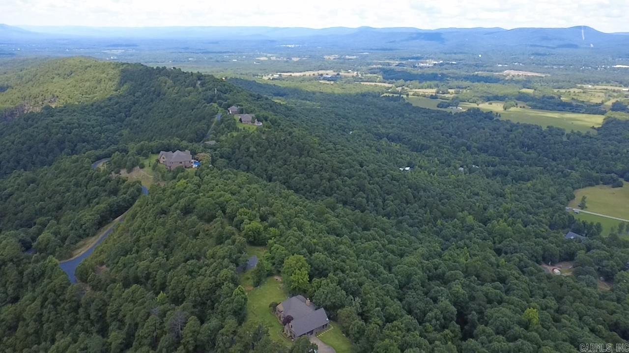 Beautiful 20.03-acre tract on Star Mountain offering privacy, mountain views, and convenient access to Mena. Ride to the Wolf Pen Gap Trail System or explore the nearby mountain bike trails. Ideal for a home, cabin, vacation rental, or recreational retreat with abundant wildlife and endless outdoor opportunities.