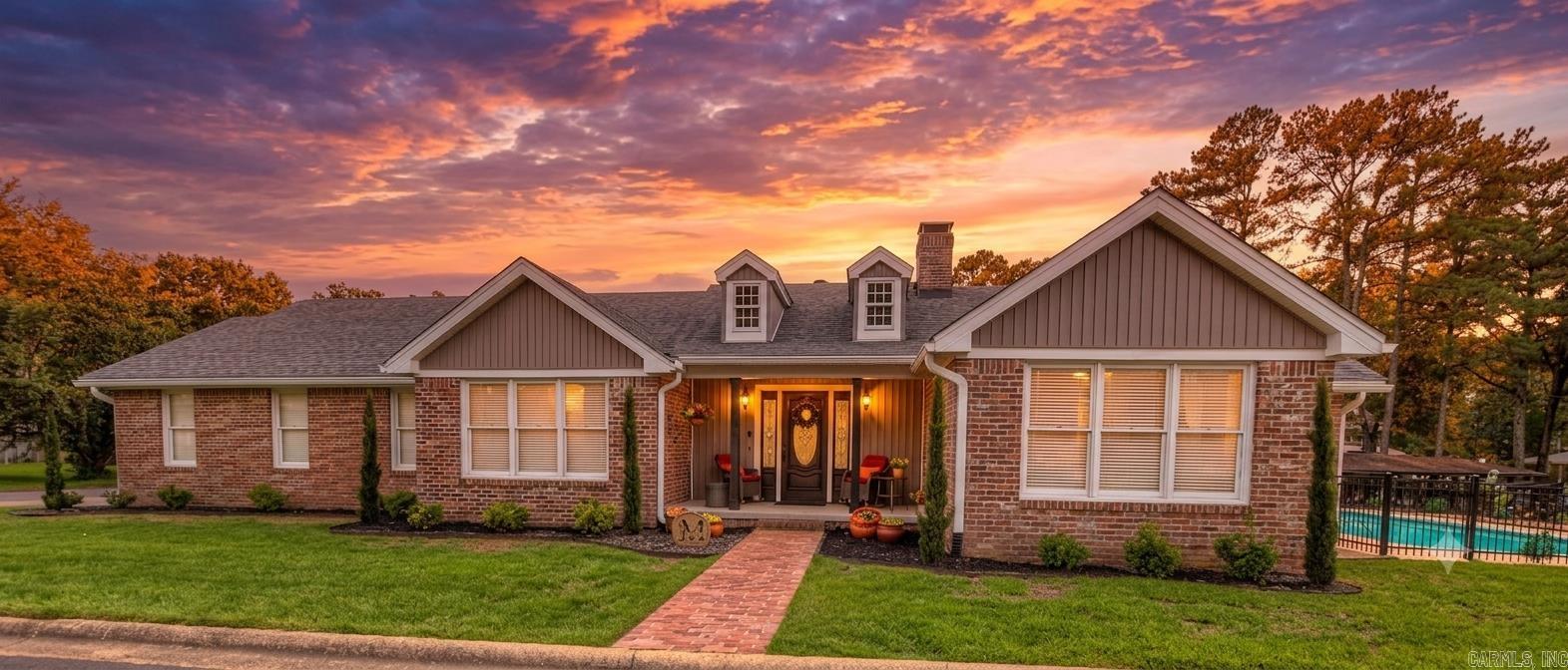 This beautifully updated one-story brick home on Lake Hamilton offers 2,562 square feet of renovated living space, four bedrooms, three full baths, a private pool, and a covered boat slip with hydraulic lift. Extensive improvements from 2023–2025 include new flooring, interior and exterior paint, granite countertops, kitchen appliances, HVAC, plumbing, upgraded electrical, updated bathrooms, new roof, and a tankless water heater. The garage received a mini-split unit, epoxy flooring, and new cabinetry. Outside, rebuilt decks span the entire back of the home, the pool was refreshed with a new pump, filter, and iron fencing, and the boat dock and ramp were fully resurfaced. The layout features formal and informal dining, a sunroom, a fireplace in the living room, and an expansive deck perfect for entertaining lakeside. Sprinkler system included. No HOA. Fully updated waterfront homes with a pool and boat slip are rare on Lake Hamilton — schedule your showing today.