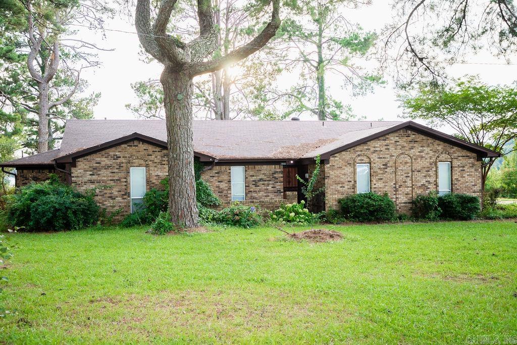 Located outside the city limits this spacious home is sitting on 1.6 acres and is partially updated! Beautiful scenery along with a large patio area! This home is located in a rural development area for possible zero down payment financing!!