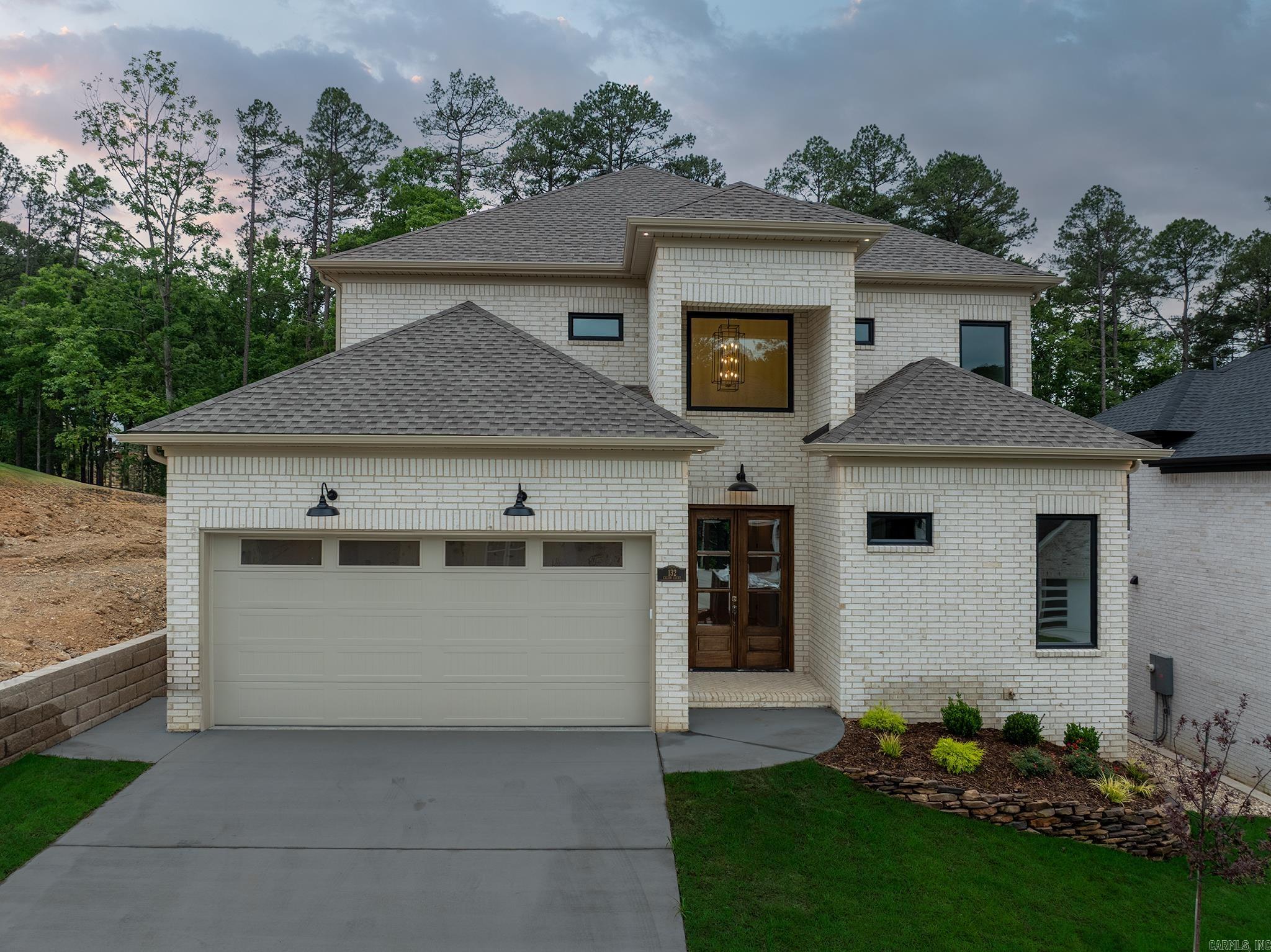 Experience elevated living in one of West Little Rock’s most sought-after neighborhood Calion Court. This stunning new construction blends luxury, warmth, and modern functionality with exceptional craftsmanship throughout. From the barn-style cabinetry and designer light fixtures to the soaring ceilings and expansive windows, every detail was thoughtfully designed to impress. Featuring 4 spacious bedrooms plus a 5th room as office or guest suite, and media room, along with 4.5 beautifully appointed bathrooms. The oversized loft area upstairs creates the perfect second living space, game room, or entertaining area. Premium hardwood flooring flows throughout the open-concept layout and main level, filled with natural light and upscale finishes. The chef’s kitchen is a true centerpiece with custom cabinetry, oversized island, walk-in pantry, premium finishes, and a stylish dry bar complete with a custom wine rack — perfect for entertaining guests. The spacious living area seamlessly opens to the covered back porch for effortless indoor-outdoor living. Conveniently located near Pinnacle Mountain, Two Rivers Park, and the Arkansas River. Schedule your private showing today!!!
