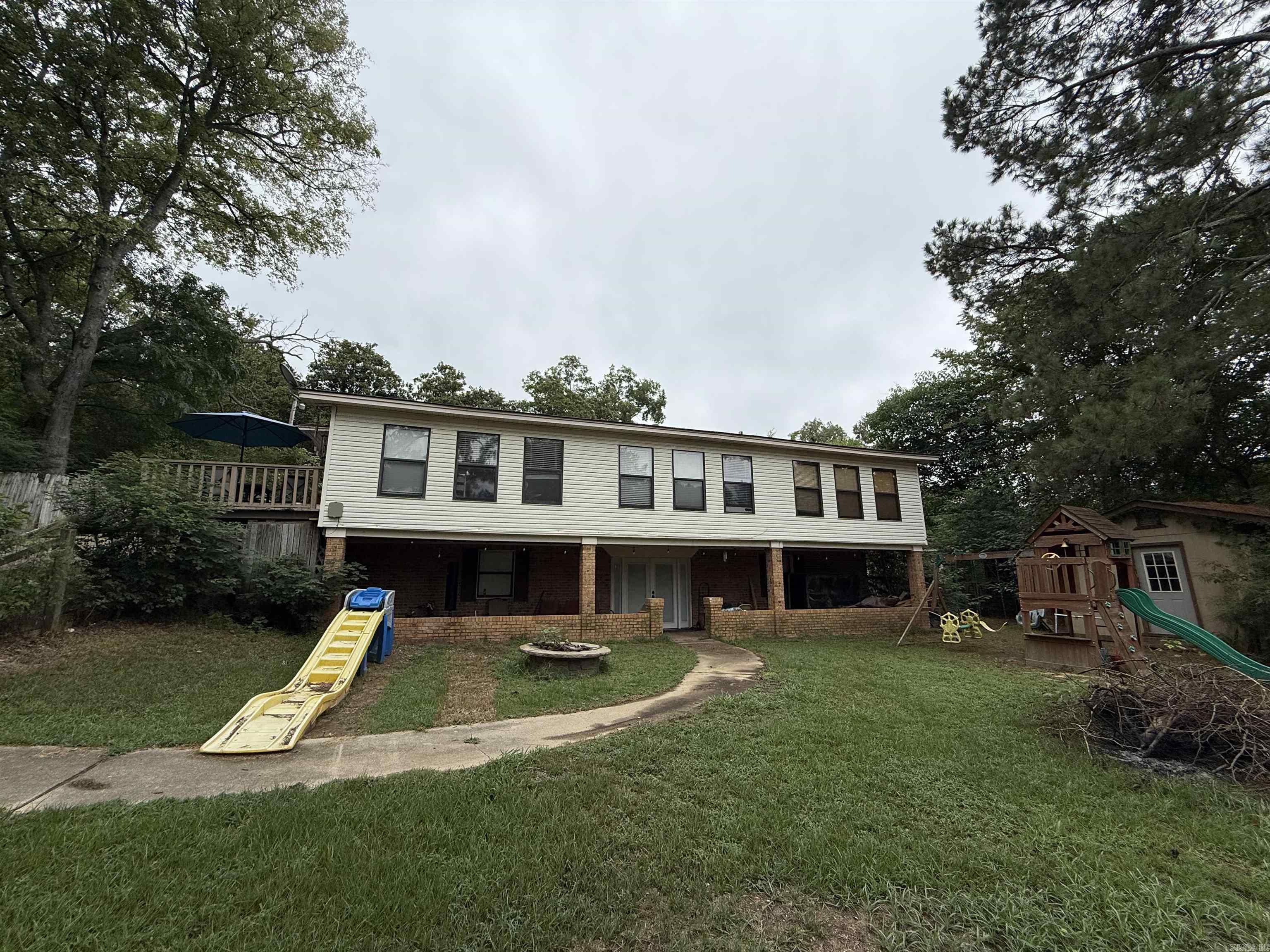 Located minutes from Lake Greeson and the Crater of Diamonds State Park, if you are looking for Space, this 2-story, walk-out basement offers over 3,800 sq ft of living space to include 4 bedrooms and 3 full baths.  Large living room, chef's kitchen offers, double refrigerators, with ice makers, double wall oven with warmer, built in microwave, dishwasher, gas stove top with breakfast bar.  Lots of cabinets and built-ins, separate dining room, additional office space or bonus area. Master suite with double closets and walk in dressing room/closet with vanity and sink, master bath, jacuzzi tub, shower and vanity with extra storage.  Downstairs offers an additional bedroom, laundry room with cabinets and storage, full bathroom and large entertaining room, walk out french doors to covered patio.  Partially fenced, storage building and garden shed, double garage, gas hot water heater, 2 CH/CA units, and newer roof.  Contact our office for more details, or to schedule a private showing.