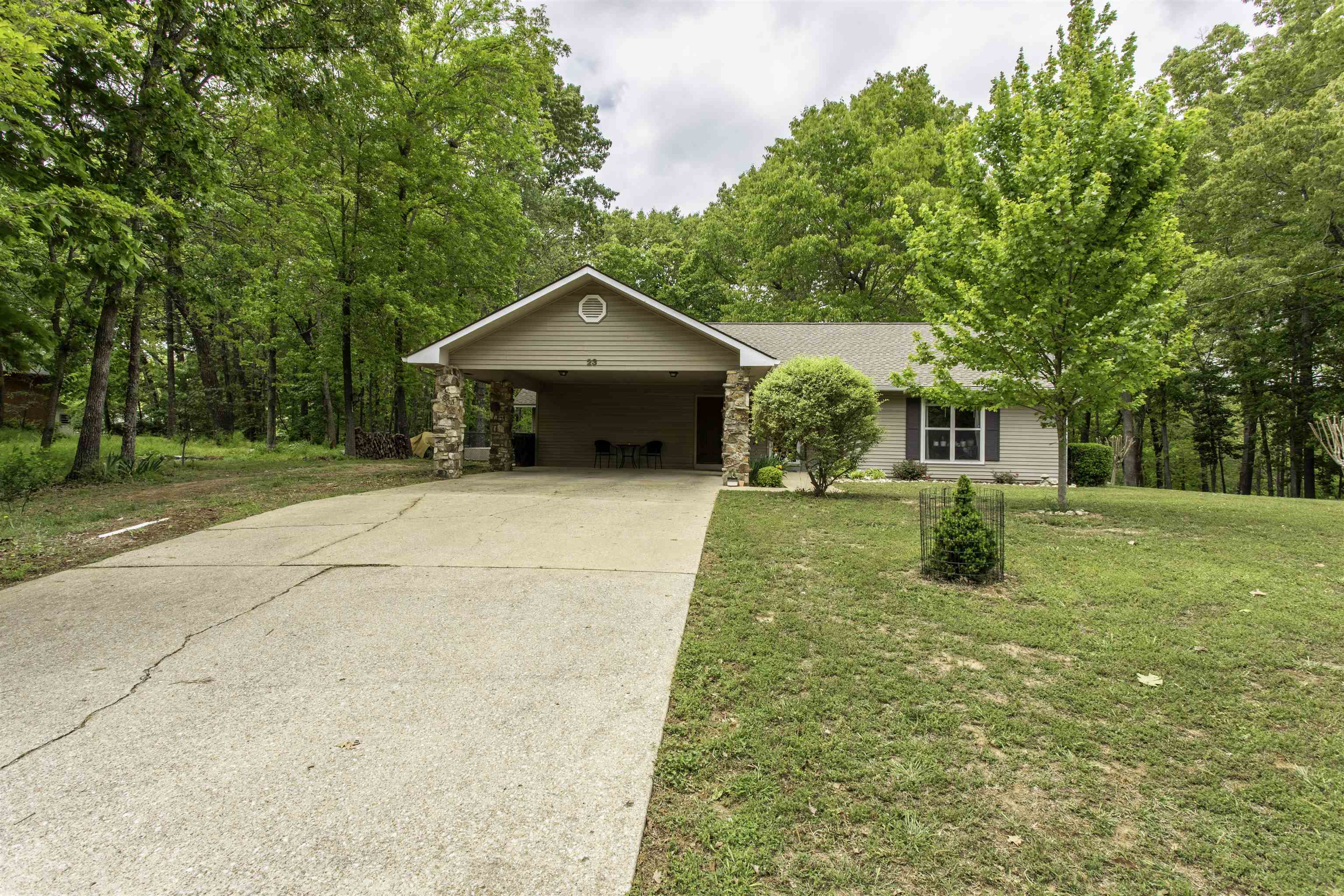 Thunderbird Lakeview home   Welcome to 23 Winnebago Circle in Cherokee Village! This well-kept 3 bedroom, 2 bath home offers 1,651 square feet of comfortable living space and sits on **three mostly flat corner lots** with beautiful landscaping and plenty of room to enjoy the outdoors. Split floor plan with semi open concept.   Inside, you’ll find a spacious living room, hardwood floors, and a functional kitchen featuring stainless steel appliances. The inviting sunroom is equipped with a mini split and overlooks the fenced backyard, making it a great spot to relax year-round. Outside, the property offers a large carport, covered patio, storm shelter, and a fenced backyard with lots of usable space. 6' X 8' in ground storm shelter installed 2025. Outside storage areas.  Major updates include a roof, HVAC system, and water heater all within the last five years, giving buyers extra peace of mind. Located directly across the street from Lake Thunderbird, this property offers a wonderful setting close to one of Cherokee Village’s favorite lakes.  **Please note: occupancy will not be available until July 24th.**