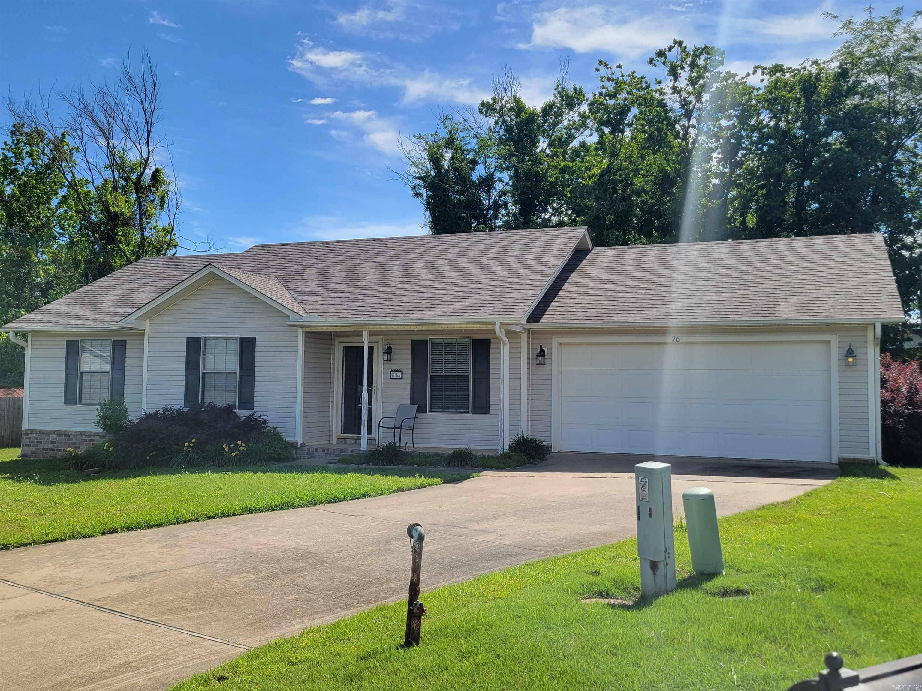 Welcome to 76 Timberwood Dr in Cabot, Arkansas — a beautiful home tucked away on a quiet cul-de-sac in an established neighborhood! This move-in ready 3-bedroom, 2-bath home offers 1,118 square feet of comfortable living space with stylish luxury vinyl plank flooring, fresh interior paint, and a newer roof installed in 2022. The functional layout provides an inviting living area, a bright kitchen with ample cabinet space, and a spacious primary suite with private bath. The oversized 2-car garage includes an additional storage room, giving you plenty of space for tools, hobbies, or seasonal items. Step outside to enjoy the fully fenced backyard — perfect for pets, kids, entertaining, or relaxing evenings outdoors. Conveniently located near local Cabot amenities including Cabot Community Pond Park, Veterans Park, and nearby walking trails, plus shopping, restaurants, and everyday conveniences along I-57. Easy access to Cabot schools and just a short drive to Little Rock Air Force Base makes this location ideal for commuters. Affordable, updated, and move-in ready — this one is a must-see. SOME PICTURES HAVE BEEN VIRTUALLY STAGED. ***See Agent Remarks***