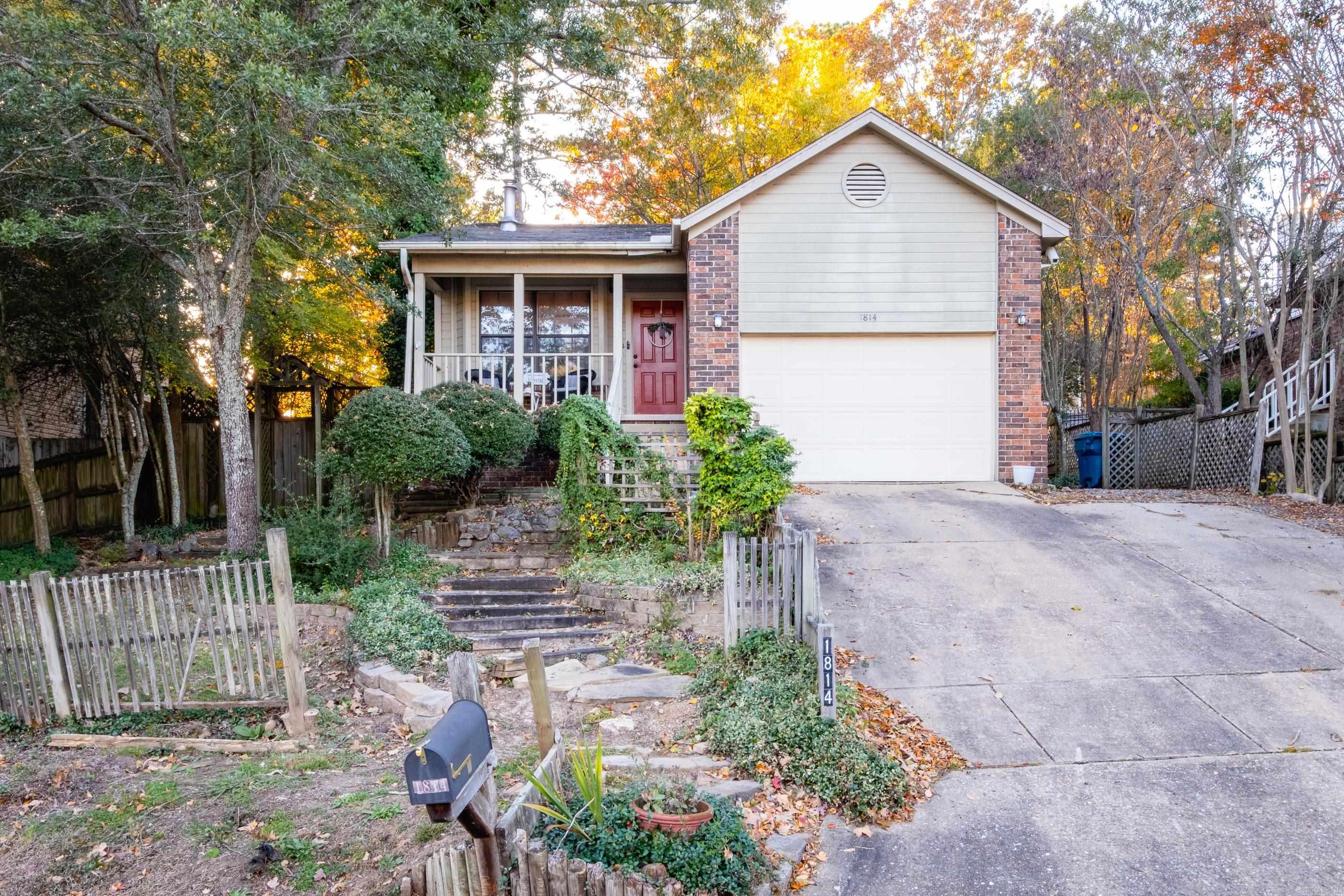 Welcome to 1814 Calgary Trail—where comfort, charm, and convenience come together in the heart of West Little Rock. Nestled on a quiet street, this 2-bedroom, 2-bath home with a dedicated office or flex space offers the perfect blend of function and style.  Step inside to vaulted ceilings and a cozy wood-burning stove that anchors the open-concept living and dining areas—ideal for both everyday living and entertaining. Fresh interior paint throughout creates a bright, updated feel from the moment you enter. A home warranty is offered and appliances convey—schedule your showing today.”  Outdoors, enjoy a thoughtfully designed yard featuring rock pathways, established flowerbeds, and private seating areas—perfect for relaxing or hosting. An oversized garage provides exceptional storage and versatility to fit your needs.  A home warranty is offered and appliances convey-schedule your showing today