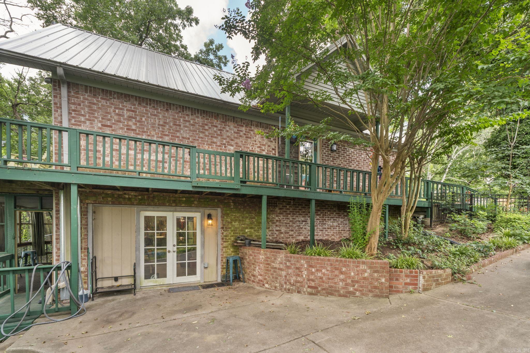 Majestic and one-of-a-kind, this 3-bedroom, 2.5-bath home offers soaring vaulted ceilings, stunning floor-to-ceiling windows with crystal accents, and a spacious layout full of character. Enjoy the convenience of two laundry areas, a detached shop, and a screened-in deck perfect for relaxing and entertaining. Major updates include a NEW roof and NEW HVAC in 2026. Nestled among mature trees with peaceful views, this extraordinary property combines charm, comfort, and functionality in a setting you’ll never want to leave.