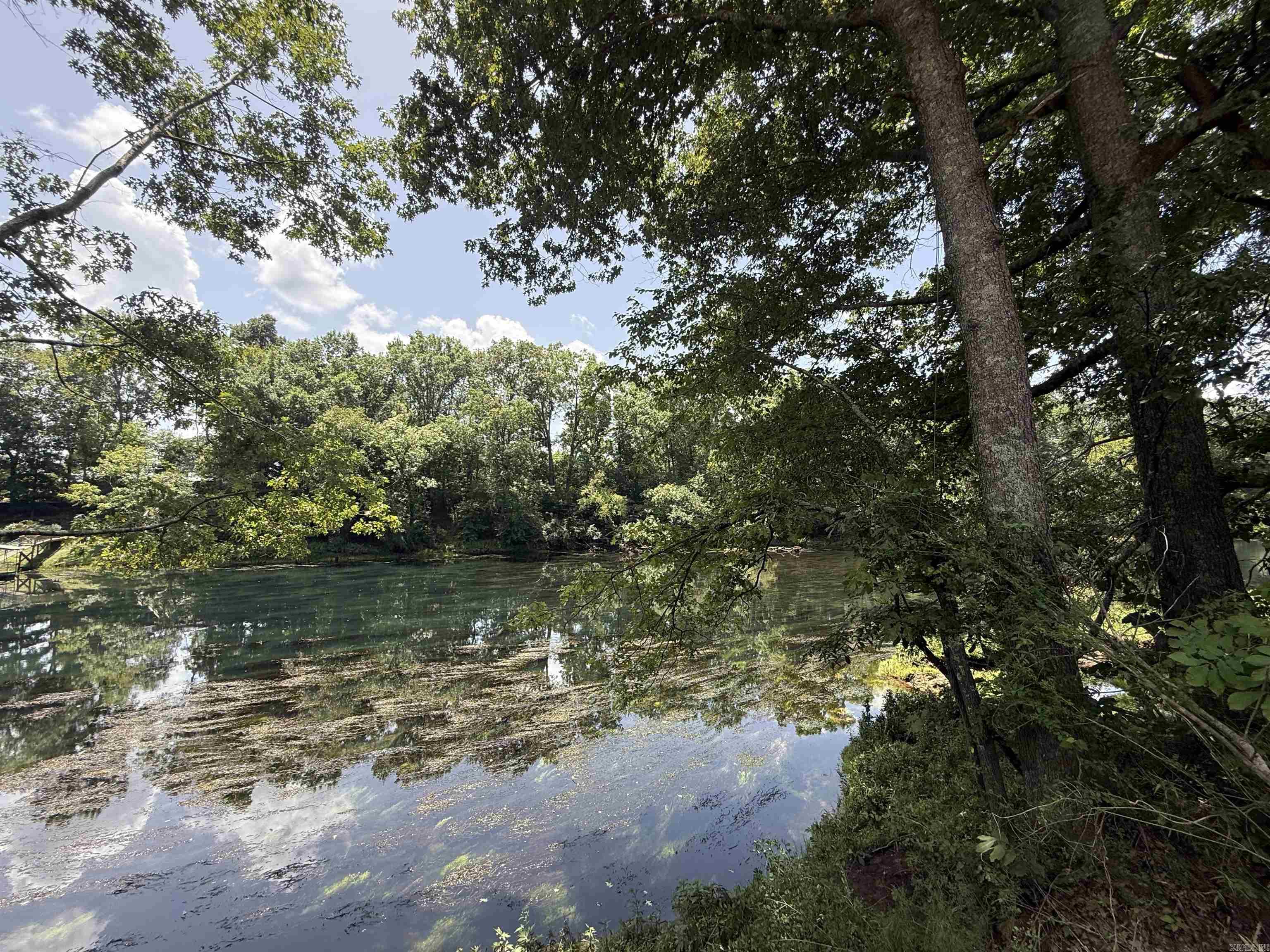 New Development inside the city limits of Heber Springs. River Wood Ranch has flat cleared lots and 19 lots along the river with trees. City sewer and water are available. Boat Ramp and Boat Dock will available by the first of 2027 for use by the residents of the subdivision. There are 8 lots that back up to the lake with views of the lake and Sugarloaf Mountain. Roads are currently gravel but as the lots are developed the roads will be paved.