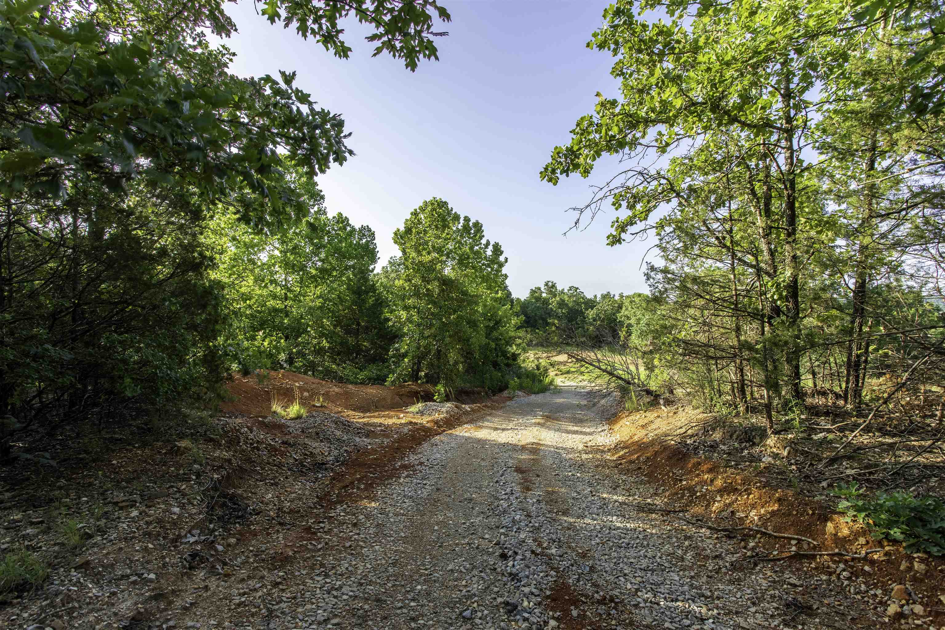 36 Acres ± in Sharp County, Arkansas | Build, Hunt, or Escape  Discover the possibilities with this beautiful 36-acre tract in Sharp County, Arkansas. Mostly wooded for privacy and wildlife habitat, the property features a sizable clearing that would make an excellent homesite with potential vista views of the surrounding Ozark foothills.  Utilities are available with access to electricity, making development more convenient. Would require a Well for the water source, making development more convenient. Whether you're looking to build a secluded homestead, create a weekend getaway, or enjoy recreational use and hunting, this property offers the space and setting to make it happen.  Conveniently located near the Spring River and historic Hardy, Arkansas, you'll have easy access to fishing, floating, shopping, and local attractions. The property is accessed by paved road to the property line, with a county-maintained gravel road bordering the tract for year-round accessibility.  If you've been searching for acreage with utilities, privacy, and outdoor recreation opportunities, this Sharp County property deserves a closer look.