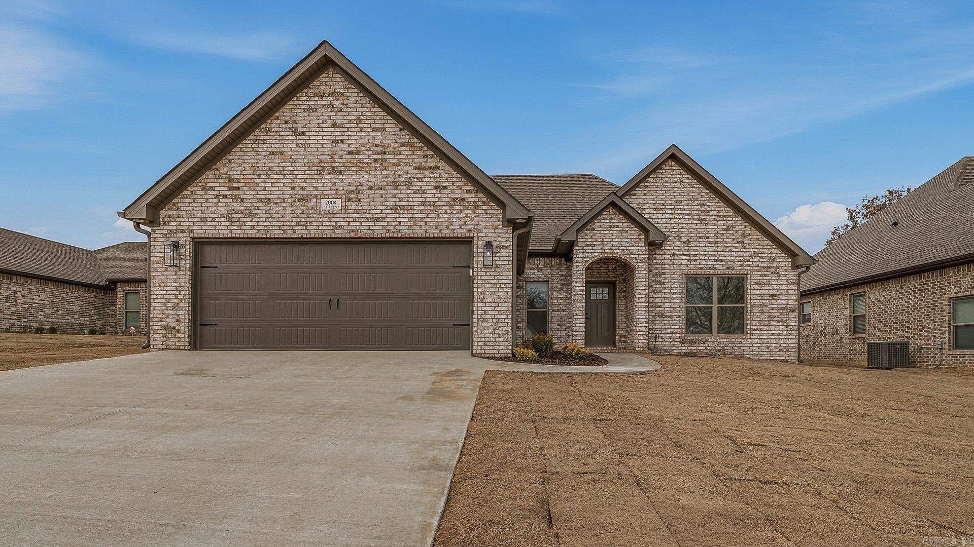 Looking for a three bedroom home with a maintenance free all brick exterior? This one level open concept plan features a split bedroom layout, offering privacy for the primary suite while guest rooms share a hall bath. The island kitchen with quartz countertops is sure to impress, and the primary suite includes two sinks, a separate shower, a freestanding tub, and natural light from the frosted window above the tub for a luxury feel. Seller is offering $5,000 toward buyer closing costs or upgrades with an acceptable offer.