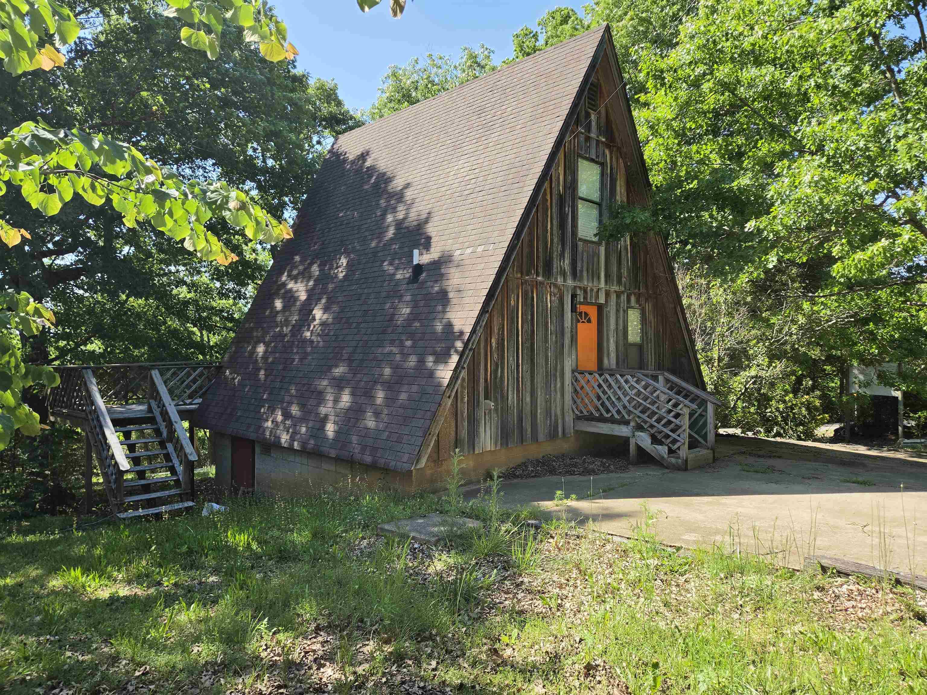 Furnished A-frame ready for you or keep it as a nightly rental. Cute little place right of the highway in Hardy Arkansas. Conveniently located between lakes of Cherokee Village and Spring River in Hardy for whichever water fun you prefer. 1 bedroom loft includes small sitting area set up with couch and TV. Window unit to keep your sleeping area extra cool. Main level has open floor plan with kitchen, living and dining areas. Sit at the breakfast bar or use the table in the alcove. French doors out to deck which spans the back of the home. Pantry in the kitchen and linen closet in the living room. All electric home with ductless minsplit for efficient heating and cooling. Updates include painting, flooring, fixtures, appliances within the last 3 years, washer/dryer less than a year old, upstairs ac 1 year. No restrictions since you are outside Hardy city limits.