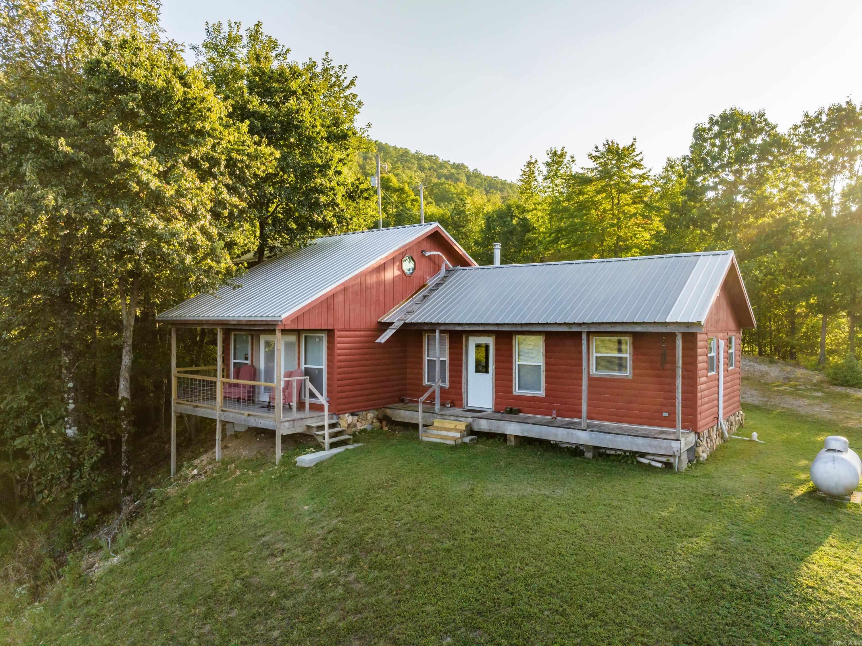 Charming 2-bedroom, 2-bathroom cabin situated on 4 scenic acres with beautiful views and plenty of privacy. Previously operated as a successful Airbnb, this property offers excellent potential as a short-term rental, vacation retreat, or peaceful full-time residence. Enjoy the mountianous serene setting, open space, and relaxing atmosphere while still having convenient access to nearby attractions and amenities.