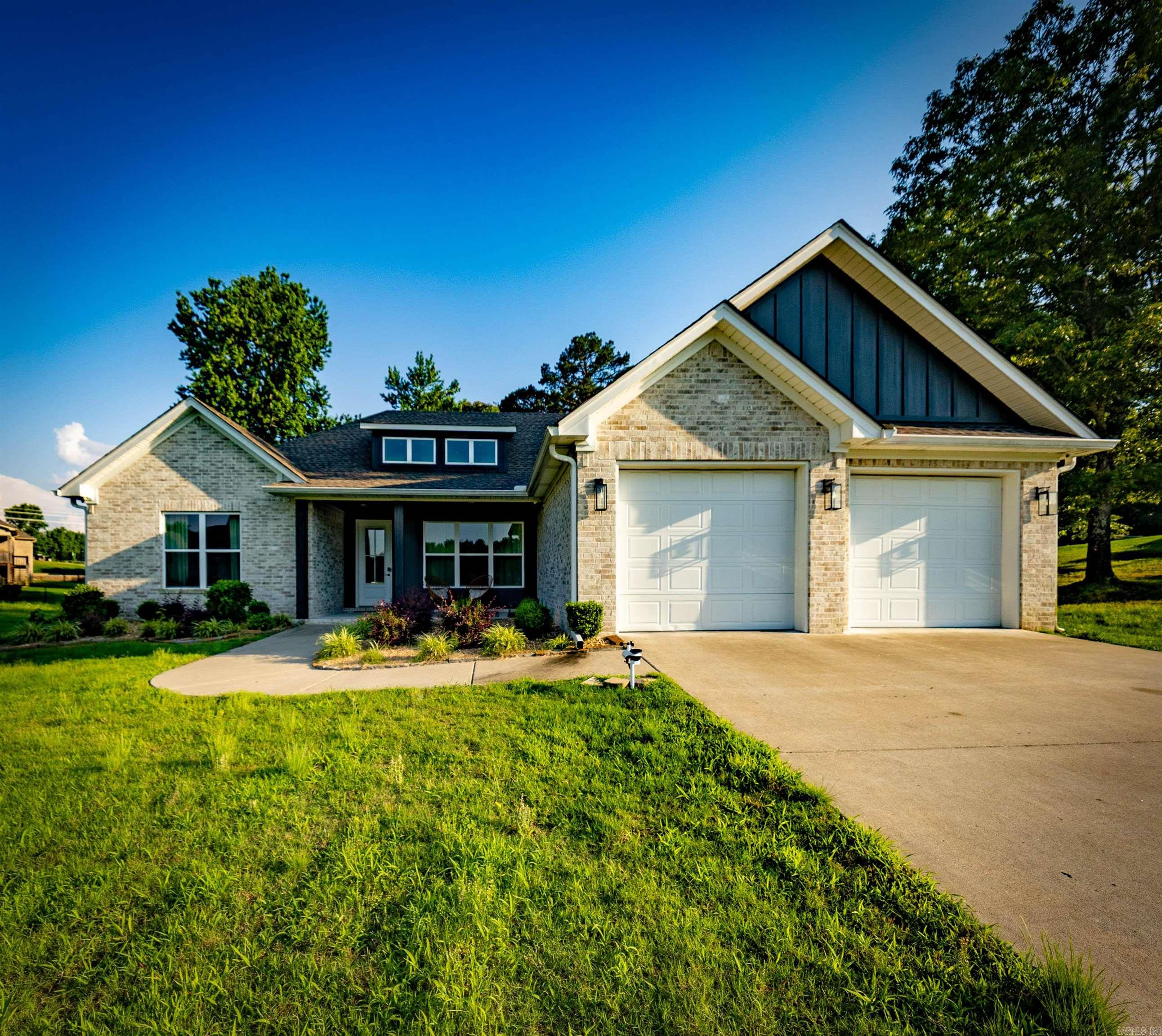 Come see this beautiful newer single-level home situated on a nearly one-acre, mostly level lot. Featuring stylish modern finishes and updated lighting fixtures that will remain with the home, it offers both comfort and convenience.  The thoughtfully designed floor plan places three bedrooms on one side of the home, while the spacious primary suite on the other. The primary bath features dual vanities, a large soaking tub, a generous walk-in shower, and an expansive walk-in closet with direct access to the laundry room.  The garage includes durable protective flooring, and the storage/workbench along the west side of the garage can remain as well.  Move-in ready and meticulously maintained, this home is waiting for its next owner. Schedule your showing today!