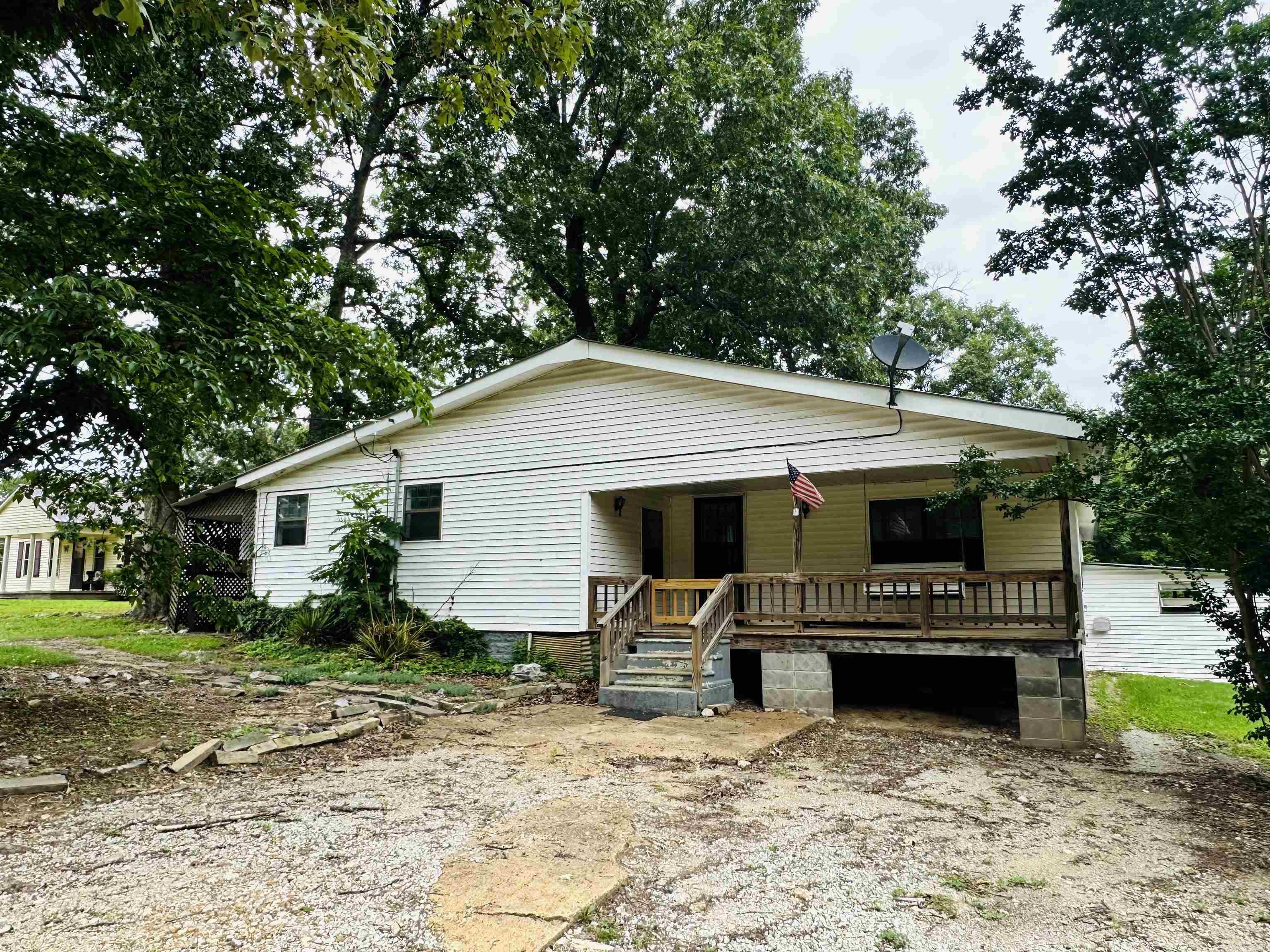 Welcome to 11 Lawrence 270 in Smithville, Arkansas! If you're looking for peaceful country living with room to make it your own, this 3-bedroom, 2-bath home is full of potential. Inside, you'll find a spacious living room perfect for gathering with family and friends, plus an additional living area that could easily serve as a formal dining room, home office, or flex space to fit your needs. Several updates have already been completed, giving you a head start while leaving the opportunity to add your own finishing touches. With a little TLC, this property could truly shine. Enjoy the quiet country setting while creating the home you've always envisioned. Don't miss this affordable opportunity to invest in country living with endless possibilities!