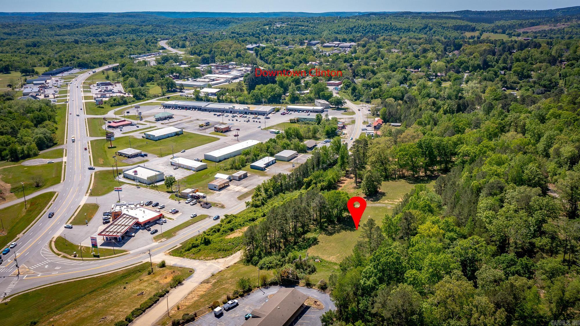 1.6 acres situated on a hilltop overlooking Clinton and Highway 65, offering excellent visibility from both northbound and southbound traffic. Located just off Highway 65B in a high-traffic area beside a well-established hotel, this property provides a strong opportunity for commercial development or investment. The tract features a good access point, with city utilities available, adding to its development potential. Enjoy gorgeous, elevated views of Clinton and the surrounding area, combining scenic appeal with prime exposure. This property is well-suited for a variety of uses.