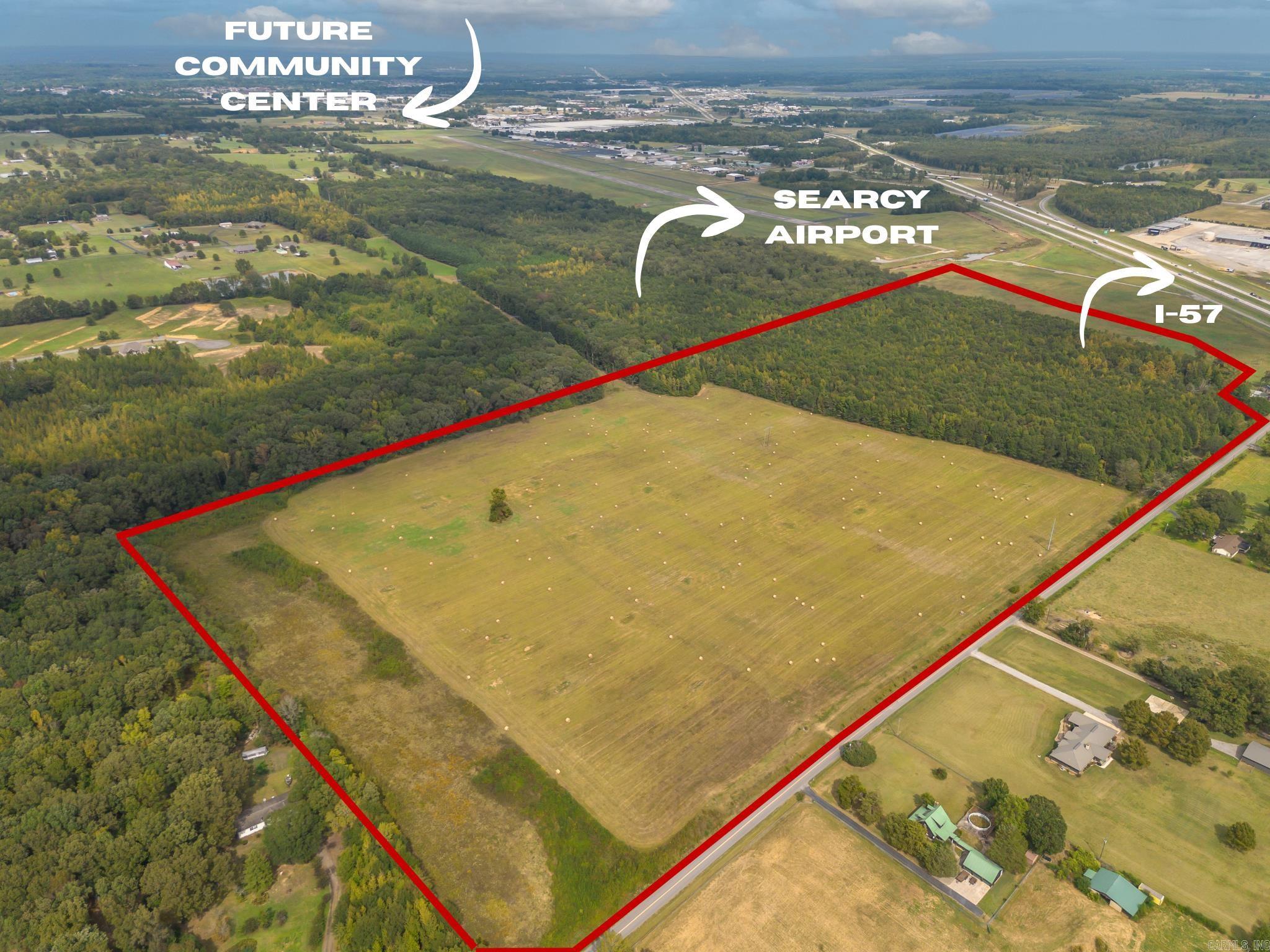 This 83+ ACRE property is conveniently located just off I-57 and is primed for significant development. Currently zoned I-1 for industrial use, its strategic proximity to Searcy Regional Airport, Walmart Distribution Center, and the City of Searcy's South Main Project, which includes a new community center, offers limitless opportunities for potential growth and investment. Lines on pictures are approximate.
