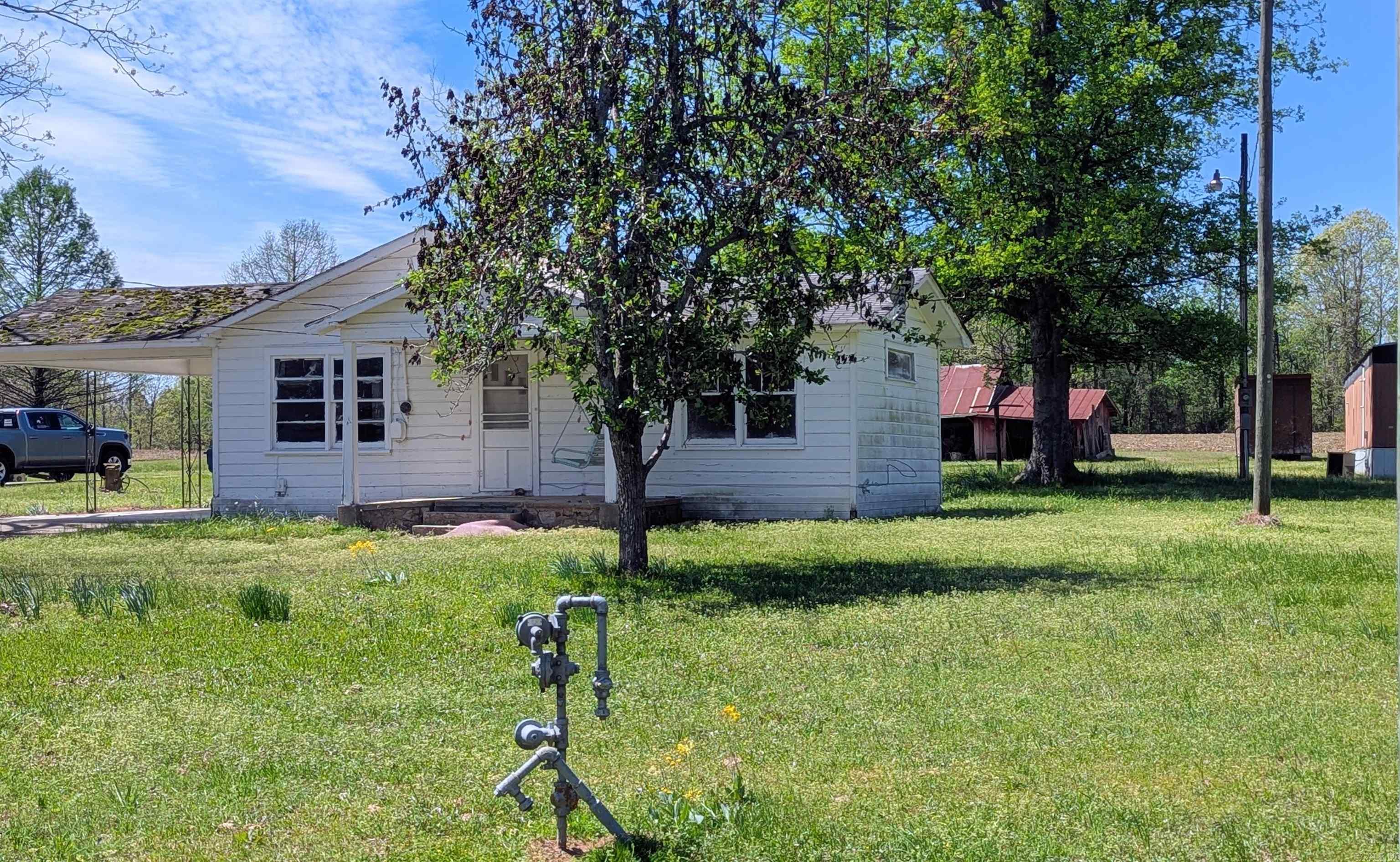 Investor Opportunity with Highway 35 Frontage!  Excellent potential on this property featuring direct Highway 35 frontage and access. The lot includes an existing house that will require a full remodel or rebuild, offering a great opportunity for investors, builders, or buyers looking for a renovation project.  A second structure is also located on the property that previously served as a 1-bedroom apartment and would require rebuilding. The property already has two septic systems in place, along with access to public water, providing a strong foundation for redevelopment.  The parcel being sold will be surveyed from the seller’s larger tract and is expected to measure approximately 100 feet of road frontage by 145 feet deep. Corners are currently marked.  Property is being sold AS IS. Utilities are not currently active. Seller inherited the property and has not occupied the home, therefore no seller disclosure is available. Buyer should verify square footage, utilities, and all property details if important.  Seller will consider Owner Financing.  Great opportunity for those looking to renovate, rebuild, or develop a property with highway exposure.