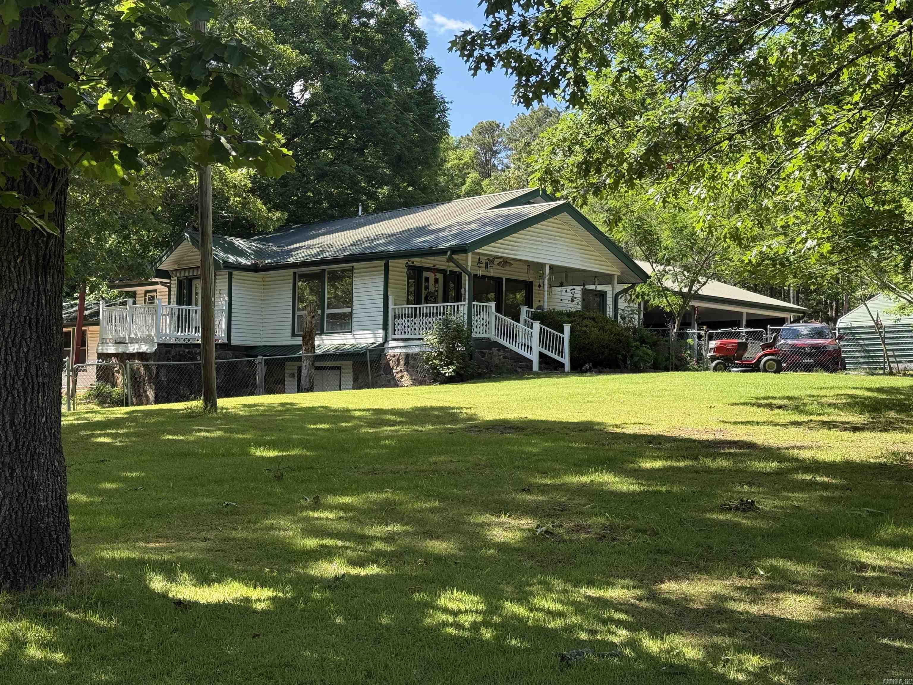 Looking for peaceful country living with lots of space? Or a weekend retreat with enough room to sleep all of the family and their friends?!  Even room for boat and RV storage. The main storage is a metal 24 x 40 ft. shed and there is also a 12 x 13 ft wooden shed with a 15ft lean to on the side. Even a large chicken coop on the back of the property! The home itself has storage everywhere. Not included in the square footage is a 648 sqft partially finished walk-out basement. Located just 3 miles from Hill Creek Marina.