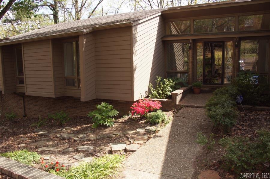 Close to PV Country Club & move in ready. Private lot backs up to wooded greenbelt! Updated home lives like a one level, with 3 beds/2.5 ba on main level surrounded w/ over sized windows framing fabulous views out back. Large living areas, up & down. Guest bed/ba down w/ wet bar & game room. Master on main level w/ custom shower & LG closet. Updated kitchen w/ stainless app., granite & grilling deck. Basketball court, hot tub & workshop in back. Separate laundry room. Comes with pool membership.