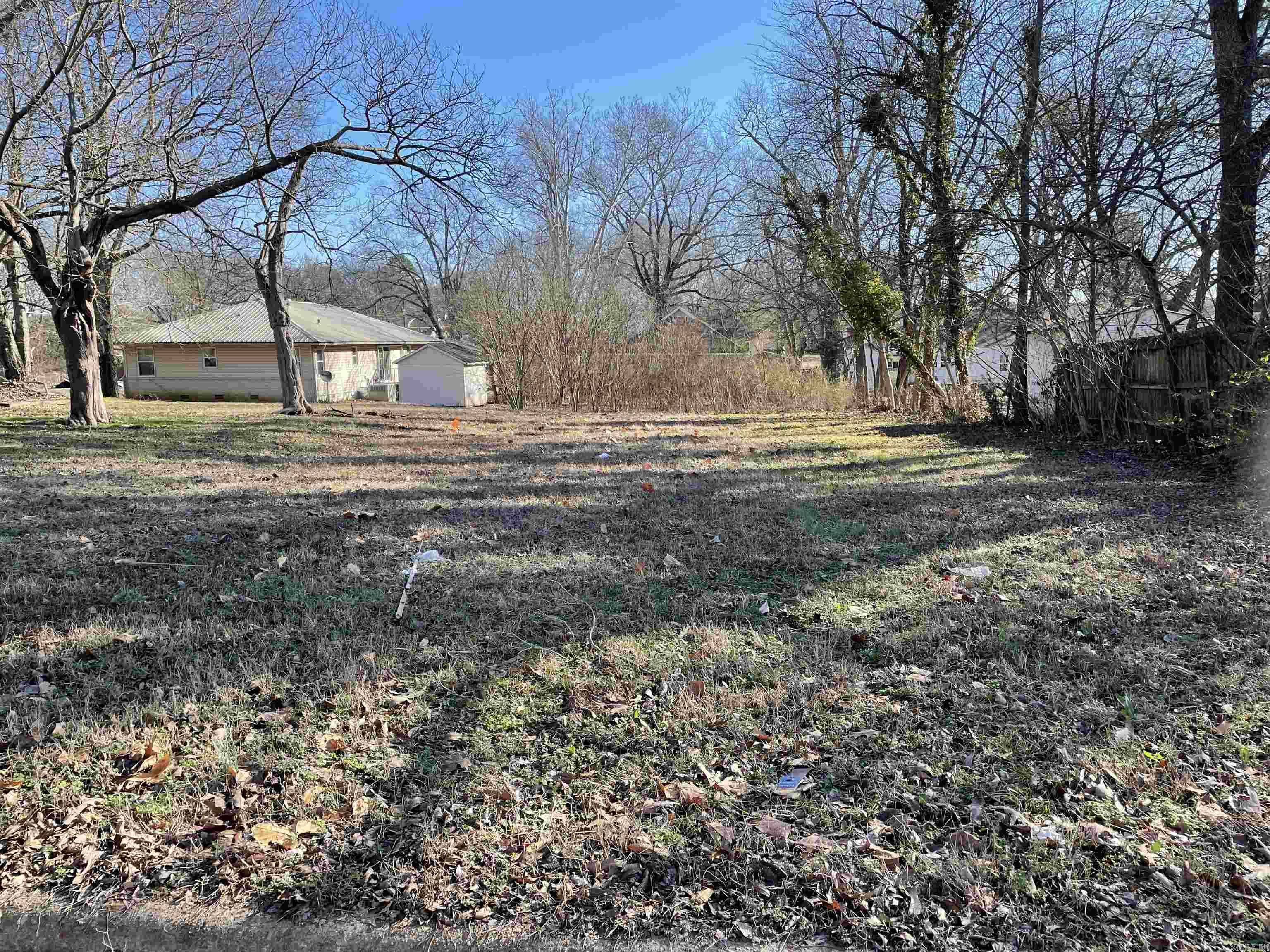 Discover the perfect setting for your new home or investment on this generous 63’ x 200’ lot located on N Pecan Street. This property offers a beautiful natural setting with mature trees providing shade and character throughout. Conveniently situated near the Post Office and just minutes from local amenities, this lot combines small-town charm with everyday convenience.  An older home once stood on the property but was removed by the sellers in 2005, leaving a clean slate ready for your vision. Whether you’re looking to build a custom home, develop a rental property, or simply invest in land with potential, this lot is a fantastic opportunity.  Features:  63’ x 200’ lot Mature trees offering privacy and character Close proximity to the Post Office and downtown Cleared and ready for your new construction  Lot does not go to Academy  SEE AGENT REMARKS