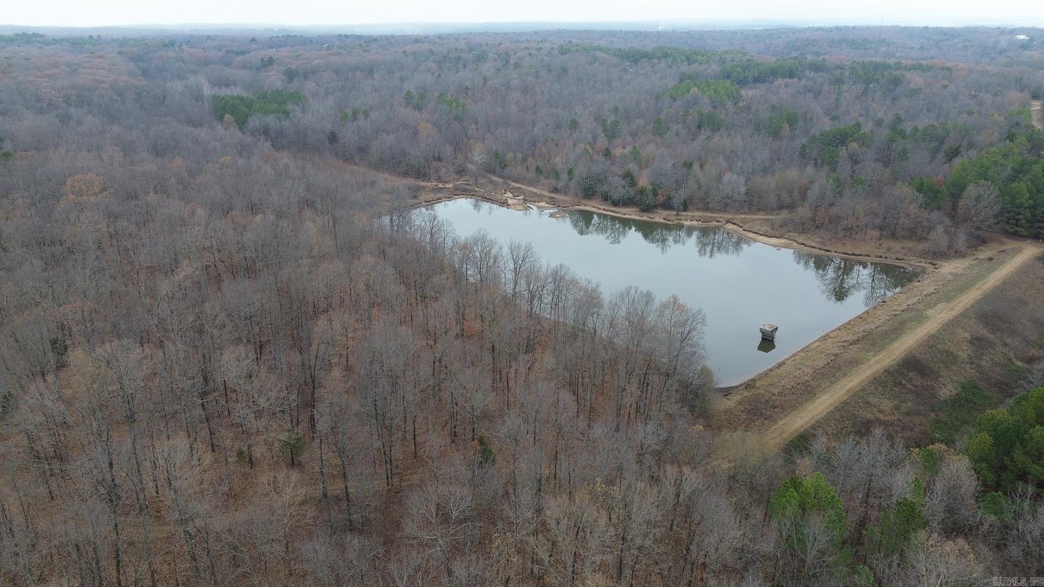 This stunning 132± acre property in Poinsett County, Arkansas is located just 15 minutes from Jonesboro and sits beautifully atop Crowley’s Ridge. With paved road access and electric and fiber internet available, the land offers the perfect balance of seclusion and convenience. The property is well suited for a private estate, dream home, or future development, providing multiple potential homesites across gently rolling terrain. A 5-acre watershed lake stocked with bass and bream serves as a centerpiece of the property, while freshly groomed trails make navigating the land easy and enjoyable. Abundant wildlife, including deer and turkey, makes this an excellent recreational and hunting property. Whether you’re looking for a peaceful retreat, investment opportunity, or a place to build and enjoy the outdoors, this property delivers exceptional versatility and natural beauty.