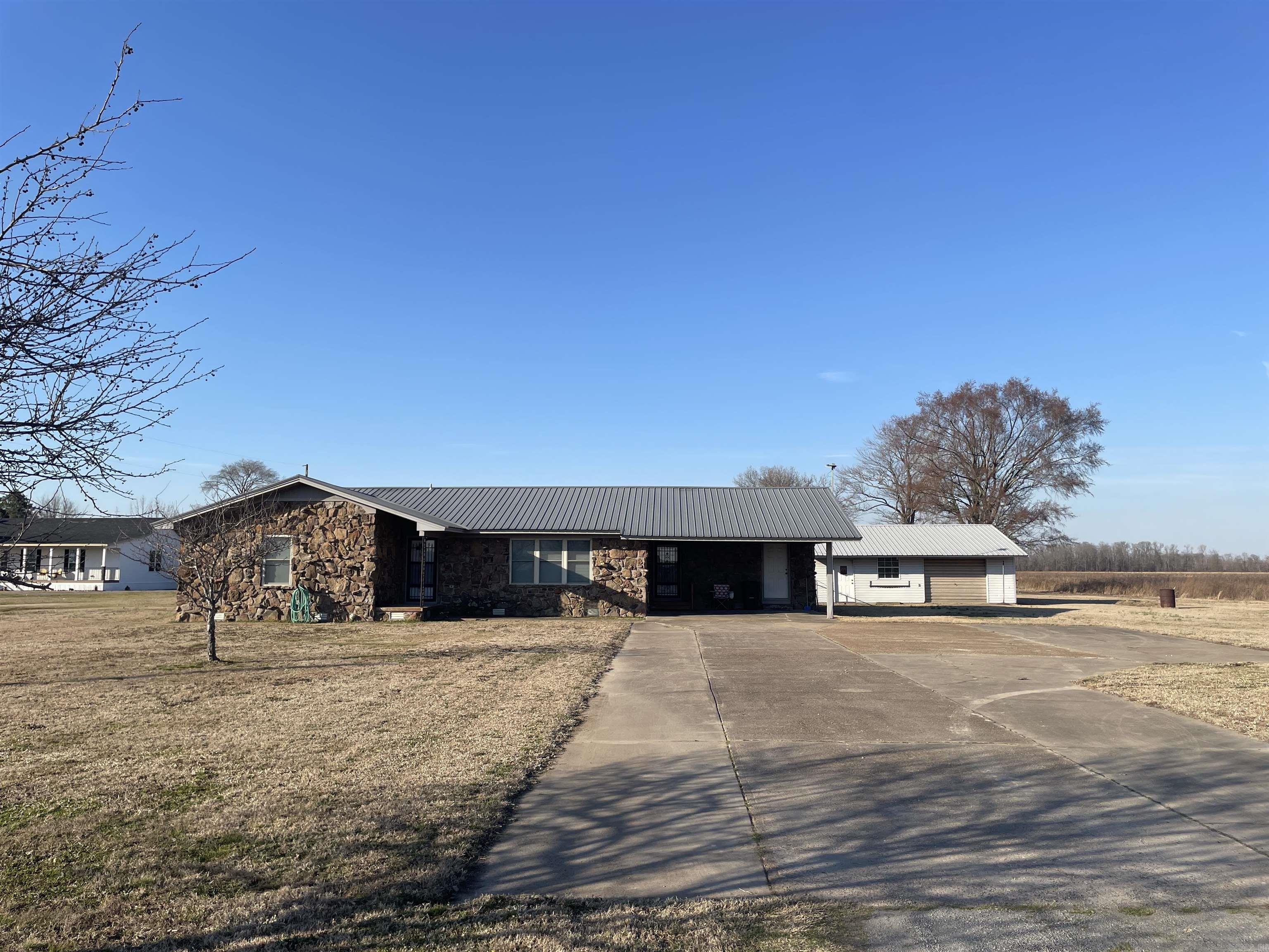 Y’all, this 3 bed, 2 bath home sitting on 3.06 acres is calling your name! With 1,668 sq ft of cozy, functional space, this place is perfect for stretching out, kicking back, and living life your way—whether that’s hosting friends, raising a few critters, or just enjoying the peace and quiet of country living.  But let’s talk about this shop—it’s BIG. Big enough to fit your truck, tools, toys, and then some. Whether you're wrenching on a project, storing gear, or dreaming up your next masterpiece, this shop's got your back.  With plenty of land, you've got room to roam, garden, or even build onto your vision. No HOA, no nonsense—just freedom and possibilities. The driveway has a large attached parking pad for a RV or any needs.  If you’re looking for a place that’s got space, personality, and the kind of vibes that make you wanna crank up some tunes or crank up the 4 wheeler for a ride and settle in, this is it. Come see it before someone else claims it as their own slice of paradise!