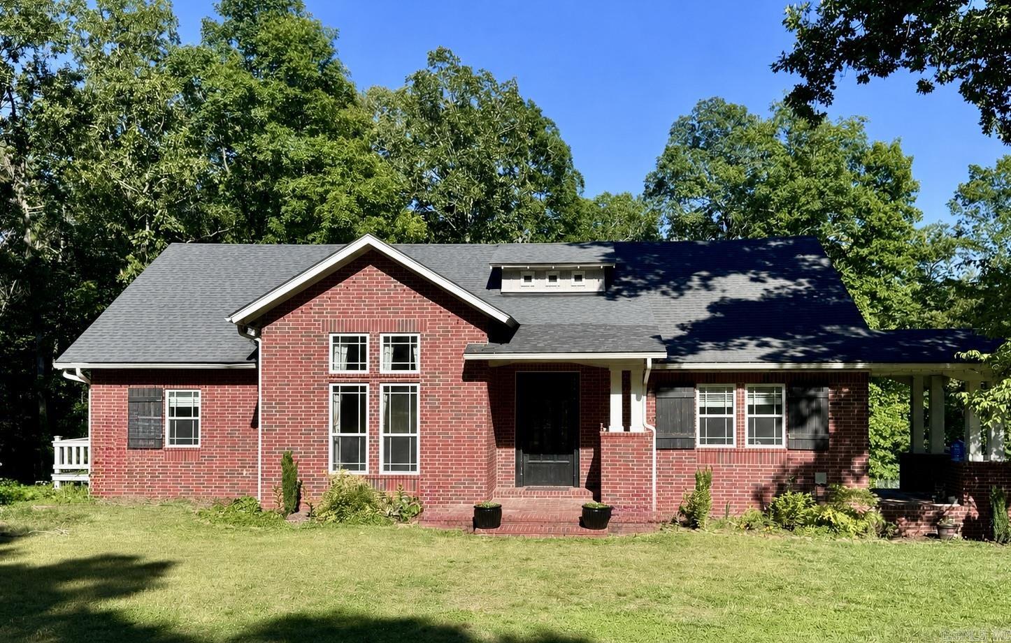 Welcome to your own private wooded retreat! This stunning Craftsman style 3BR/3.5BA home is on 12.5 wooded acres with a pond, garden, fruit trees, and abundant wildlife. 3,614 sq ft includes an upstairs theater/game room and a potential 4th bedroom or office. This home boasts a new HVAC with an air purifier, newer roof, whole-house speaker system, private deck off master, and back deck overlooking the pond. There is also a beautiful GUEST HOUSE with a bedroom, kitchen, and a living area with an electric fireplace! Attached to the guest house is a 2-car garage with an additional workspace. Additionally, there is a dedicated RV pad with full hookups. A brick gatehouse at the driveway provides curb appeal and added privacy. Perfect for relaxing and entertaining—don’t miss this exceptional property!