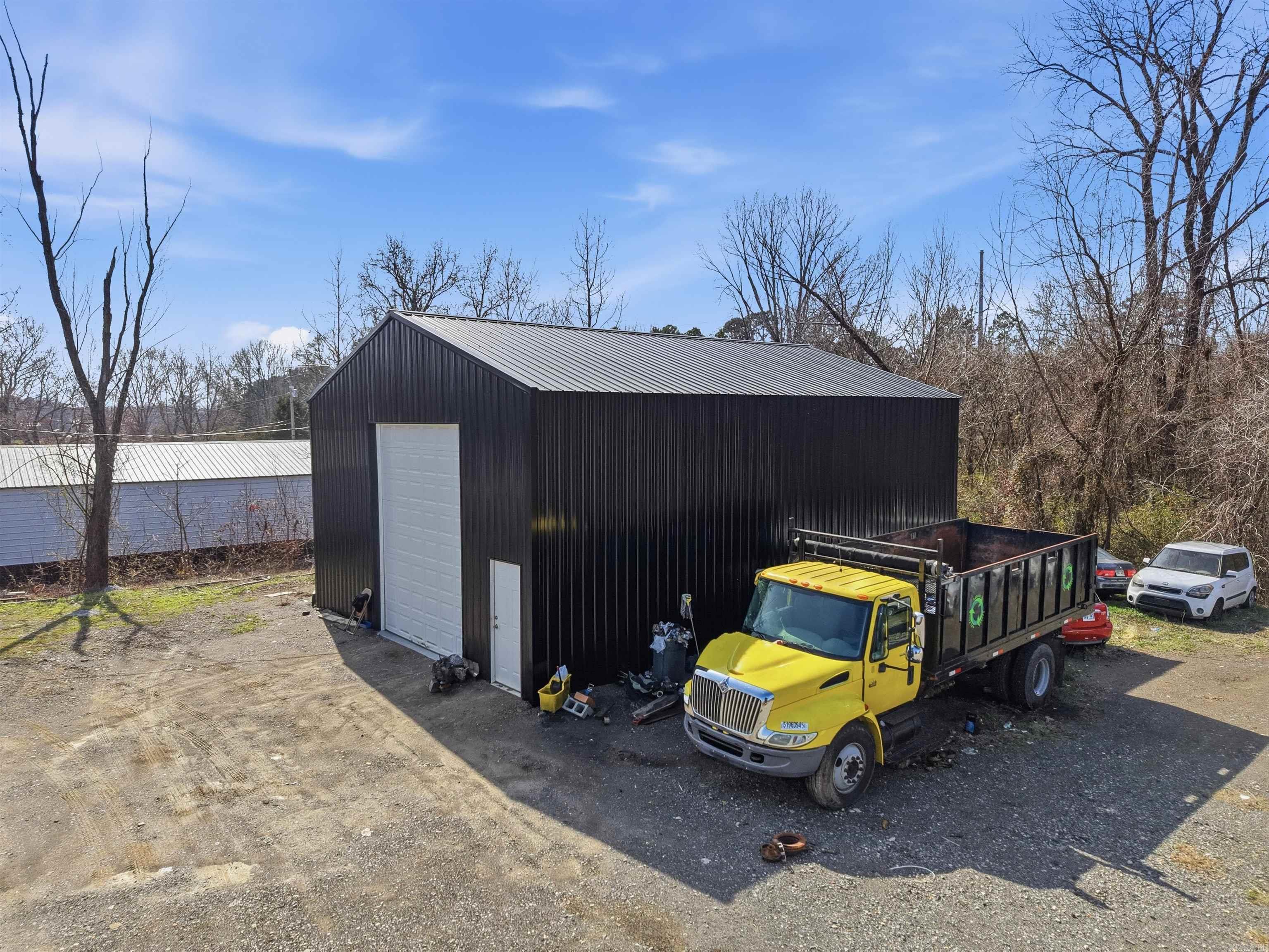 Income-producing commercial property on 3.96 acres.  This property features 4 warehouse buildings, all fully leased, offering immediate and steady cash flow.  In addition to building rentals, the site generates added income from leased, semi-truck parking spaces.  Strategically located near the interstate and Maumelle, this property provides convenient access for logistics, distribution, and service-based tenants.   A strong investment with multiple income streams, opportunity to expand, and an excellent occupancy history - ideal for an investor seeking a stable, turnkey asset.   *Agents See Remarks*