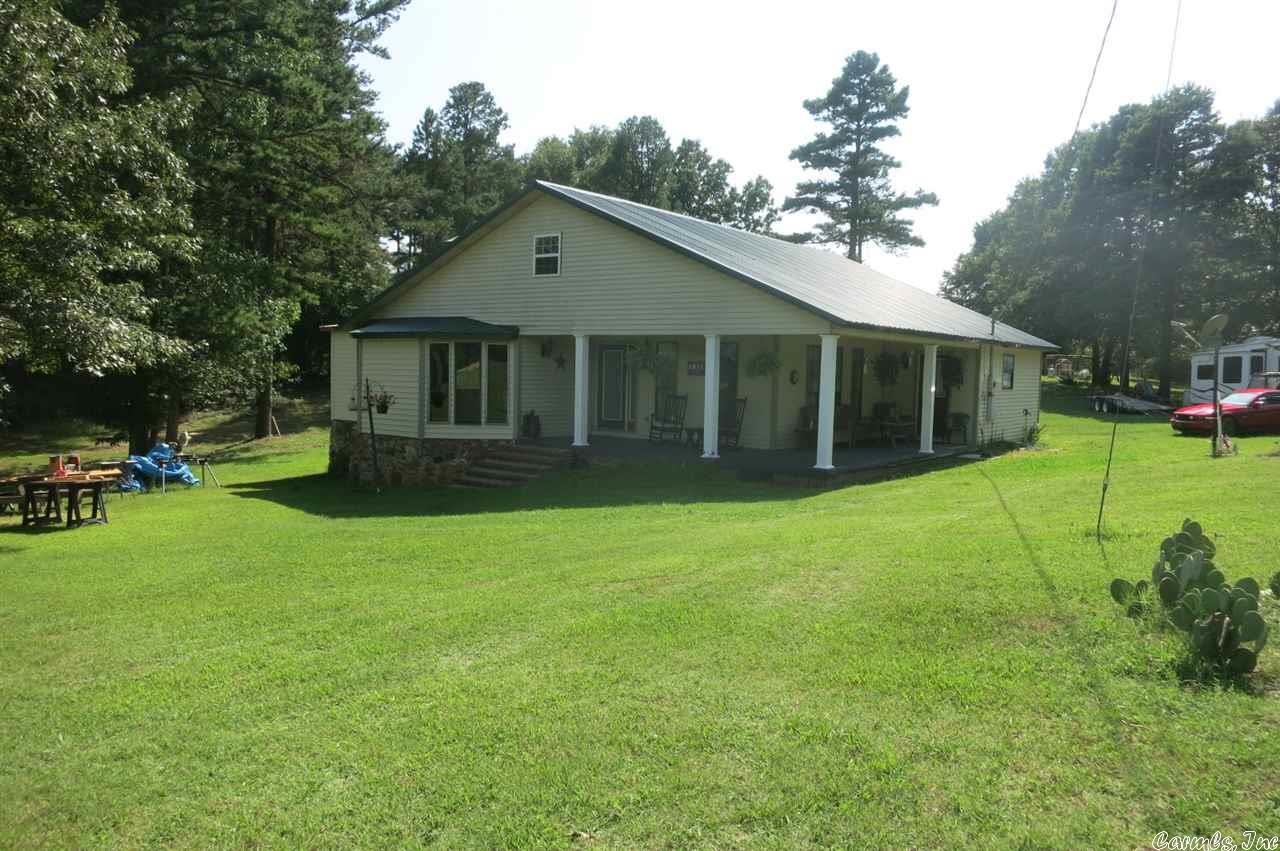 49 acre m/l working farm for cows and chickens. Fenced/cross fenced with ponds. Mixed pasture and timber. Good road frontage for easy access. The 2 story house has 2 bedrooms and 2 baths on the main floor & 2 additional bedrooms on the 2nd story. Big eat-in kitchen, rustic family room and big living room. Large main bedroom over looks the duck pond and surrounding  lawns. Interior has had a total make over, with new paint,  flooring, light fixtures and fans, appliances all updated. Metal roof, cute porch.