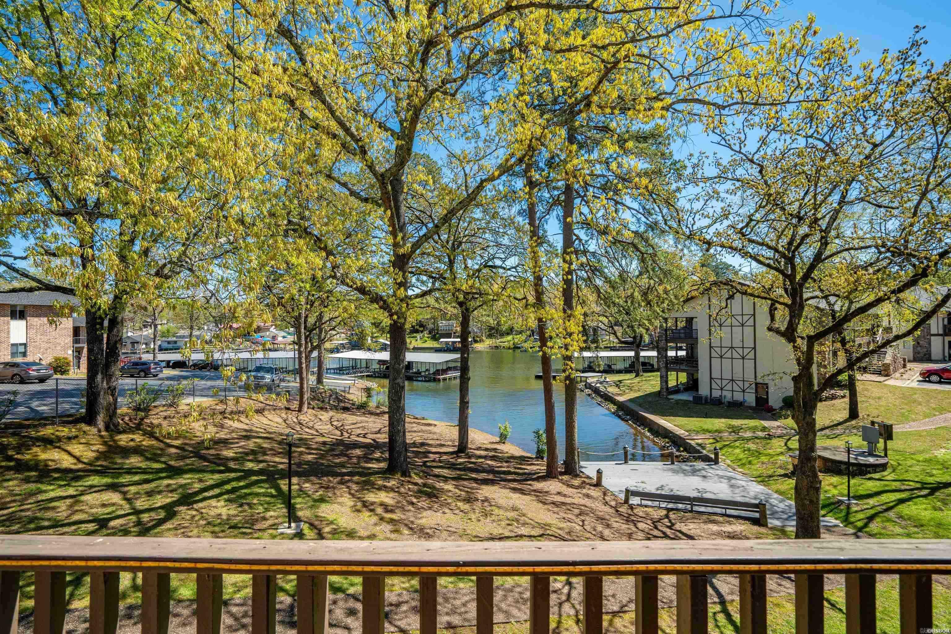 Move-in ready Lake Hamilton condo offering low-maintenance living with exceptional lake views. This beautiful upper-level unit features 2bedrooms and 2 bathrooms with an open dining and living layout, allowing you to enjoy scenic lake views directly from the living room. The kitchen and bathrooms have been newly remodeled, providing a fresh, modern feel throughout. Ideal as a weekend getaway or a full-time residence, this condo offers year-round water access and is just steps from your covered boat slip. Centrally located and convenient to everything Hot Springs has to offer by both land and water. Call the appointment center today to schedule your private showing.