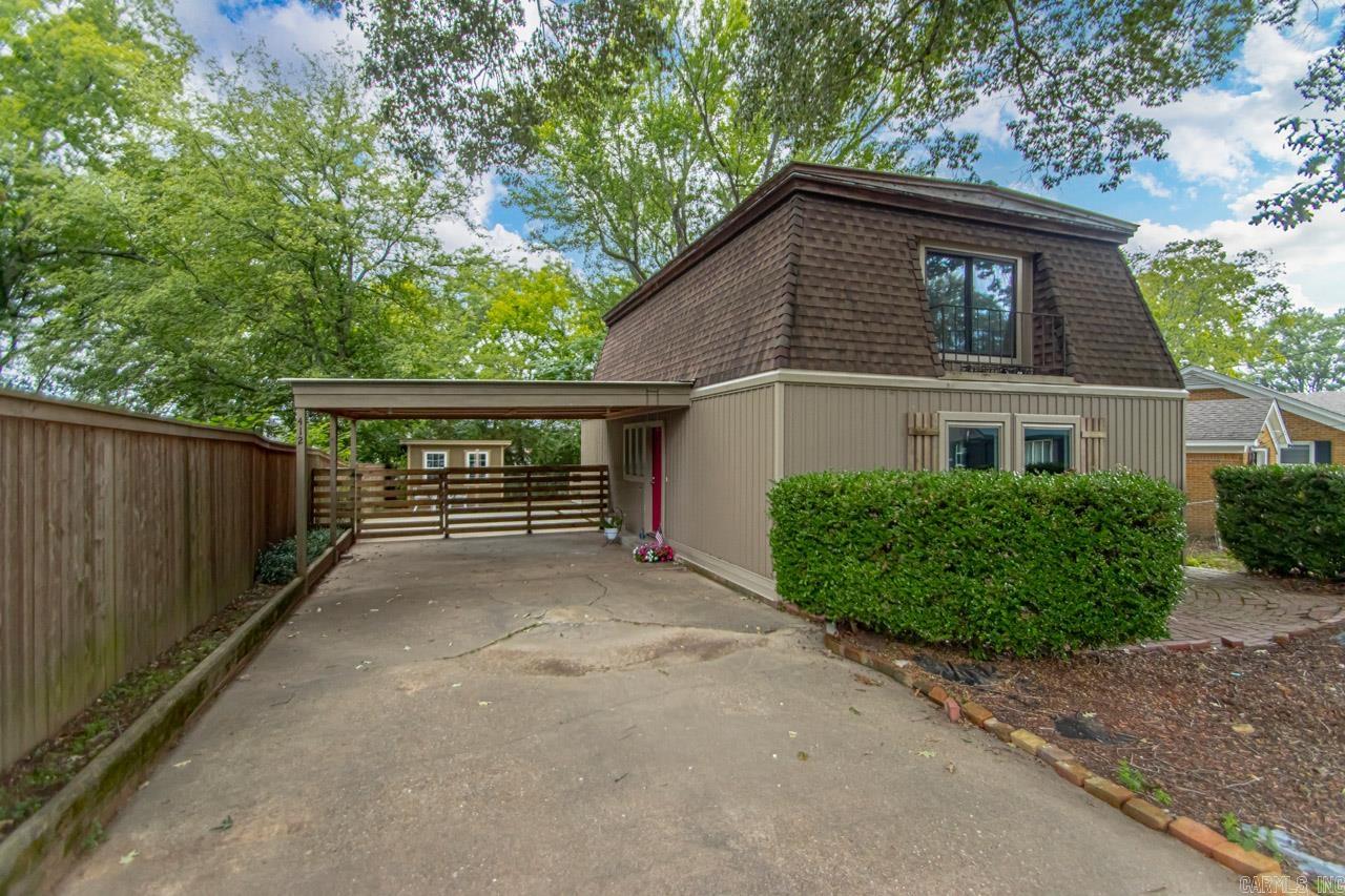 Welcome to this adorable, updated home within walking distance to all things downtown Benton and the school. The main level features two spacious living areas and a convenient half bath. The cool galley kitchen boasts a beautiful picture window, perfect for enjoying the view while cooking. Upstairs, you'll find three generously sized bedrooms and two full baths. Outside, the property includes a storage building, a large fenced yard, covered parking, and a deck, providing ample space for storage, relaxation, and entertainment.