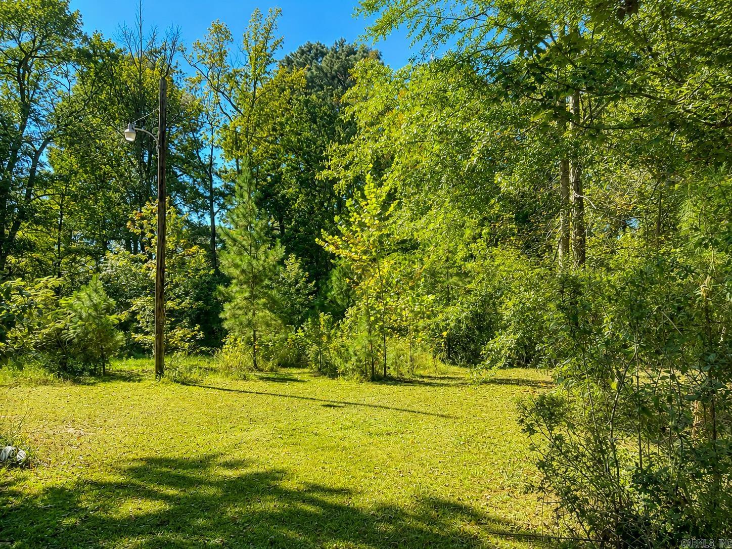 Discover the perfect canvas for your dream home with no restrictions at 7801 Holy Ridge Cutoff, just outside of Haskell in a convenient location. This level .75-acre lot sits in a quiet cul-de-sac just off Highway 67, offering both convenience and privacy. The previous manufactured home has been removed, but utilities and septic are already in place making it easy to build your dream home or place a new mobile home. Owner financing available.