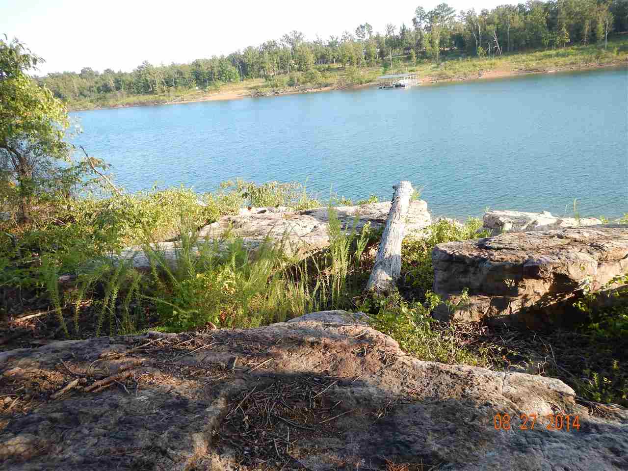 Rare opportunity !! once you get here you will not want to leave! 4 acres Lake front zoned for boat dock, You don't have to be an Olympic athlete to get to the water, Gentle sloping walk to the shore line for swimming with the kids or watching the sunset, white line almost in the lake at the SW corner of property, approx 562' of white line according to Corp boundary survey, another 6 acres also available, also zoned for boat docks, just over 1 mile from Hwy 16