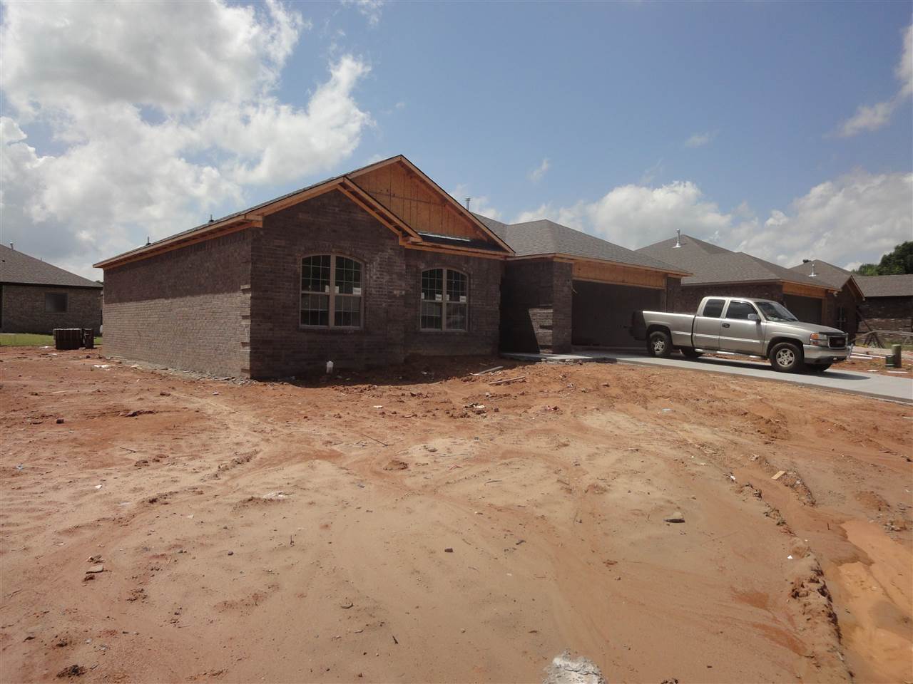 New 3 bedroom home ready for buyer!  Home offers pretty cabinets, stainless steel appliances, granite countertops, large living room with fireplace, tile floors, gas, tile showers, jetted tub, double vanities, large closets, brick. Large, covered porch, affordable home buy today!!!