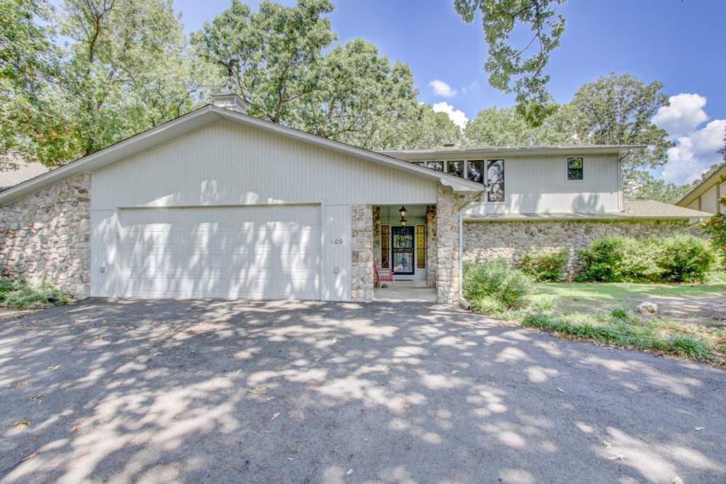 Enjoy all that lake life offers with this large Lake Hamilton home situated on a level lot with extra landscaping and beautiful views. You'll love the birds eye view from the floor to ceiling windows, out door barbecue's on the back patio or lazy day lounging on the lakeside dock! Priced to sell...this one won't last long!