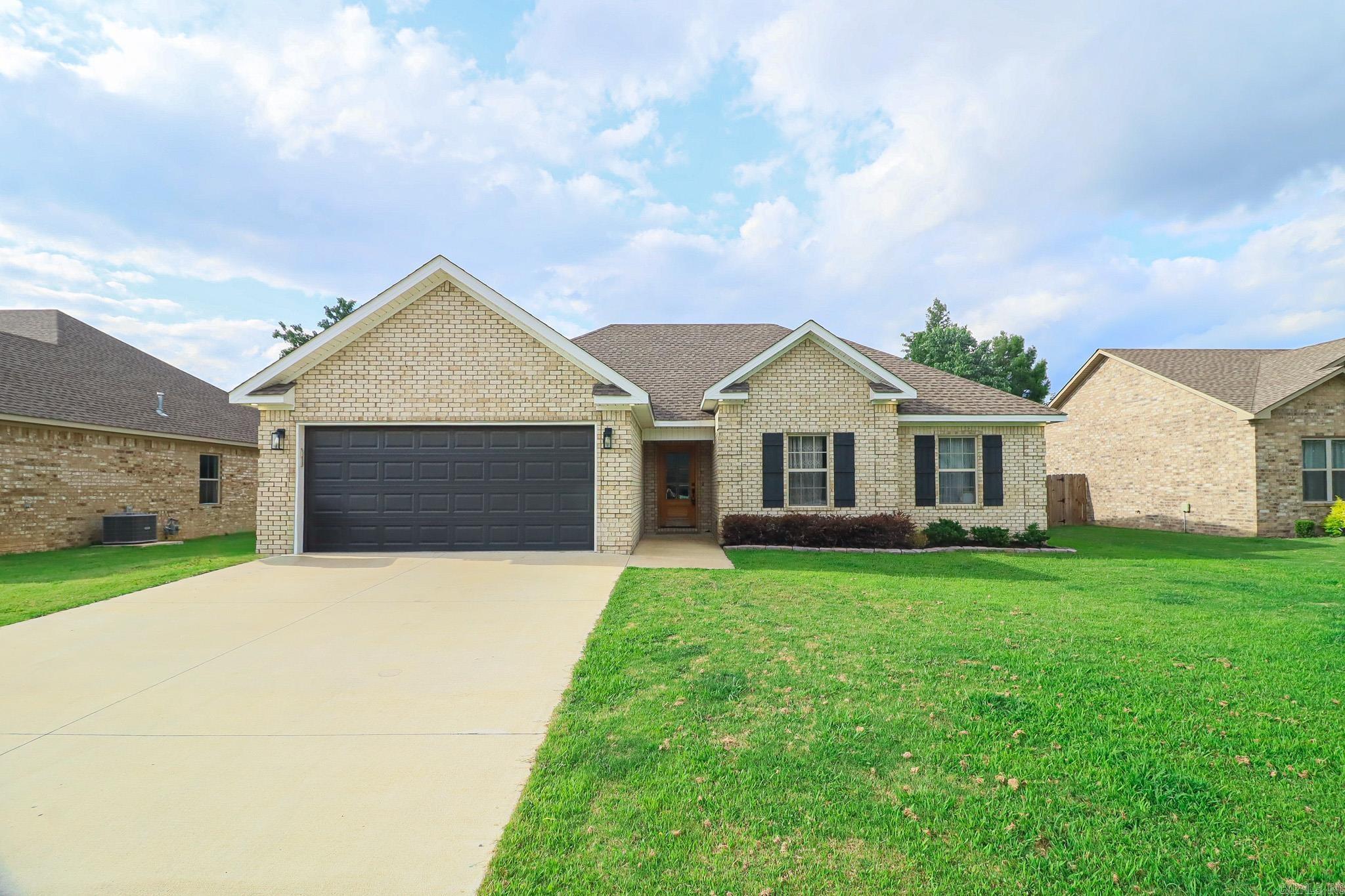 Welcome home to this adorable brick 3-bedroom, 2-bath home offering 1,450 square feet +/- of comfortable living space. The inviting kitchen features beautiful granite countertops, stainless steel appliances including a gas stove, a convenient breakfast bar, & a pantry, making meal preparation and entertaining a breeze. The generously sized primary suite is a true retreat, complete with a large walk-in closet, double vanities with granite countertops, a relaxing soaker tub, and a separate walk-in shower. Storage is abundant throughout the home with walk-in closets, a coat closet, a linen closet, and plenty of additional closet space.  Architectural details add character and charm, including a variety of ceiling styles such as vaulted and tray ceilings. Step outside to enjoy the covered patio, perfect for entertaining family & friends, while the privacy-fenced backyard provides a peaceful outdoor setting. Additional features include a double garage, gas tankless water heater, city water and sewer services, & a desirable location within the Westside School District. This charming home offers the perfect combination of style, comfort, & convenience.  Call or text today for a tour!