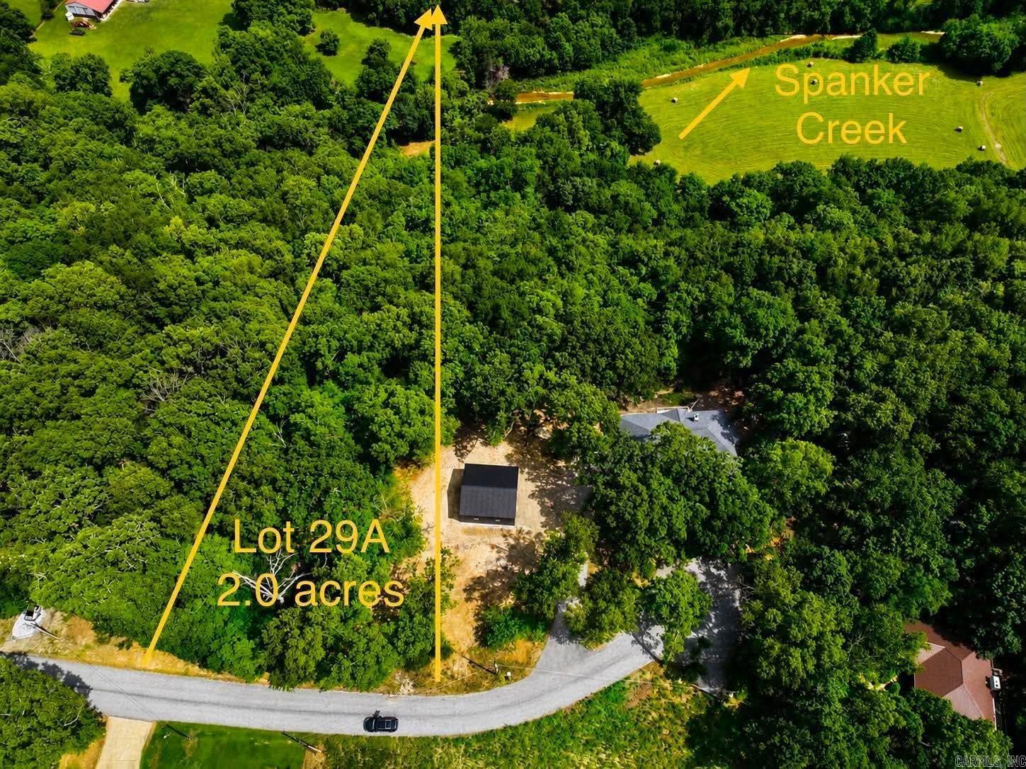Build your dream home on this beautiful 2 (+/-) acre property in one of Northwest Arkansas' most sought-after locations! Offering the perfect blend of privacy and convenience, this spacious lot is just 2.2 miles to Blowing Springs park, 1.2 miles to Wonderland Trail Head biking trail along with being only minutes to Bentonville schools, other world-class biking and walking trails, the beautiful Bella Vista lakes and bypass. Your oasis also has Spanker Creek that runs through the back of the property. Whether you're looking to create your forever home or invest in the area's continued growth, this property provides endless possibilities. Enjoy the peaceful setting while remaining close to shopping, dining, recreation, and everything Bentonville and Bella Vista have to offer with no HOA!! Don't miss this rare opportunity to own acreage in a prime location where nature and convenience come together!
