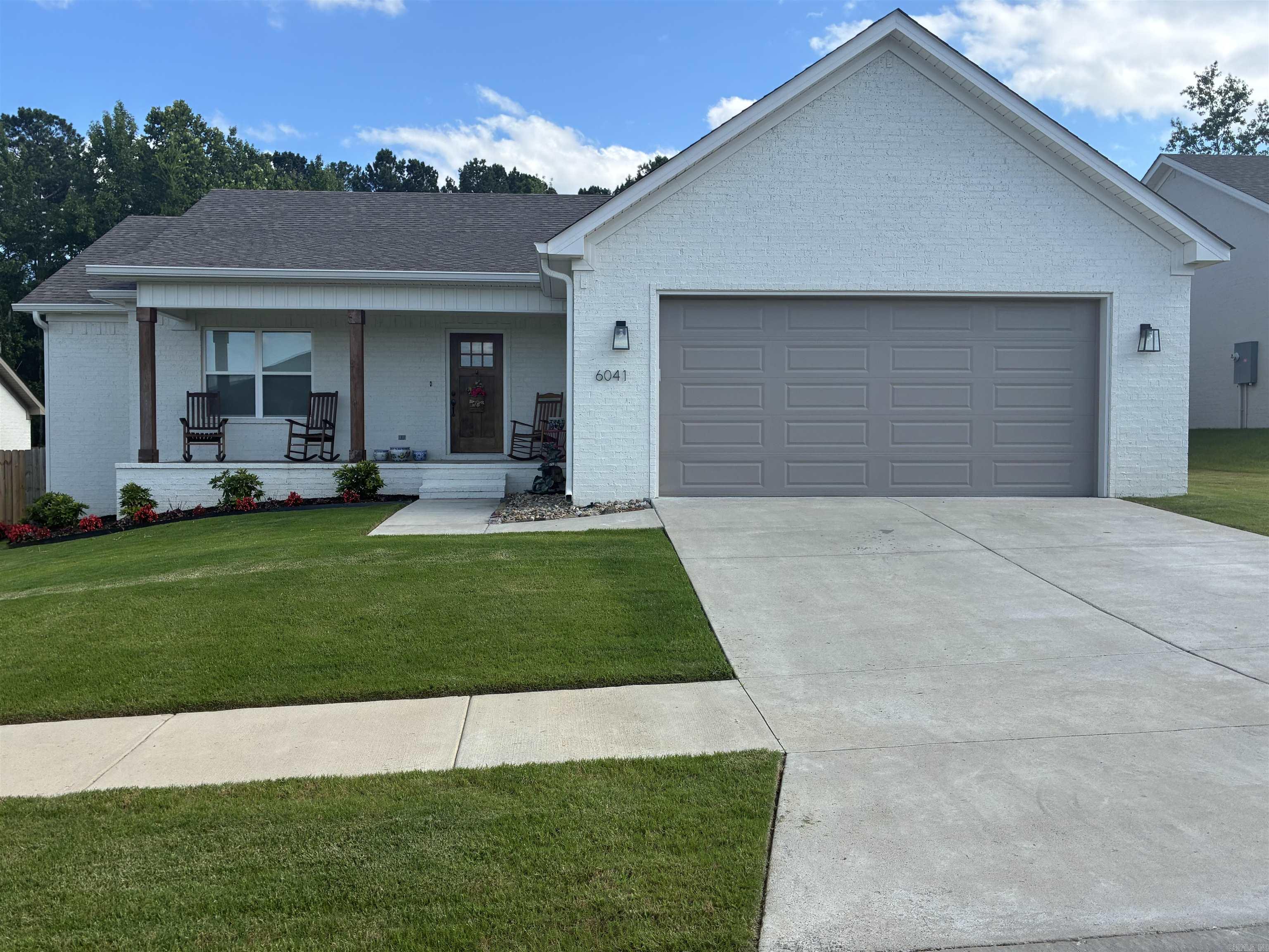Welcome Home! This beautiful traditional brick home is located in the Lombard Heights subdivision. Offering 1,890 square feet of inviting living space, this home features 3 bedrooms and 2 full bathrooms. Step inside to discover a thoughtfully designed floor plan with a welcoming living space highlighting a fireplace, leading to a kitchen that serves as the heart of the home. The spacious kitchen features a breakfast bar, gorgeous quartz countertops, a walk-in pantry, and a freestanding gas range. The primary bedroom is thoughtfully set apart for added privacy and boasts a spacious walk-in closet. Its en-suite bathroom features a luxurious walk-in tile shower and an elegant double quartz vanity. Two additional well-appointed bedrooms provide versatile space, while a dedicated laundry room adds everyday convenience. Outside, enjoy a level lot with a fully wood-fenced backyard and a covered patio, providing a wonderful setting for outdoor relaxation.
