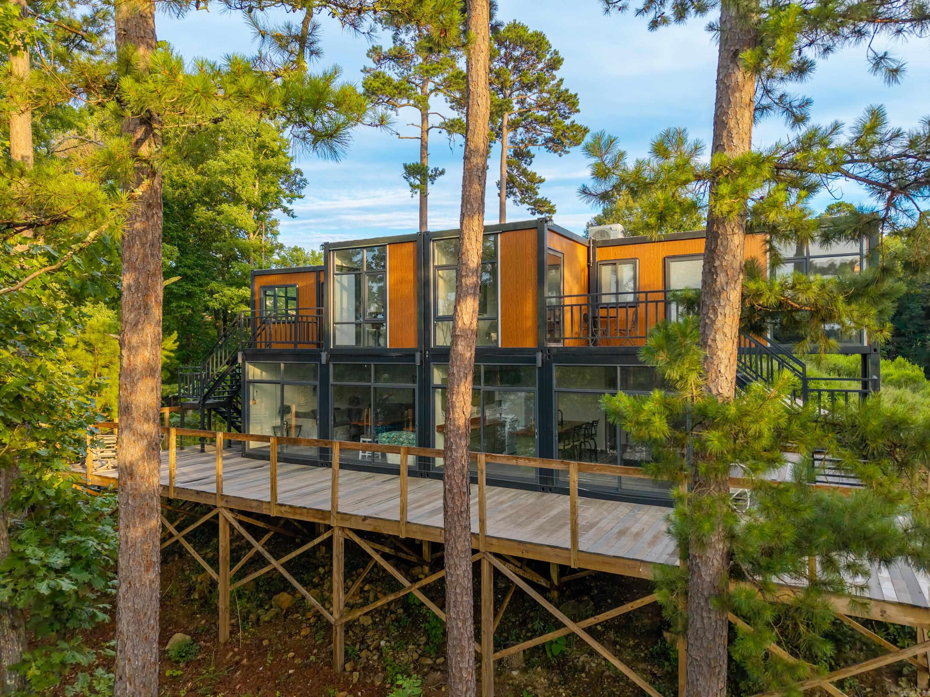 Excellent investment opportunity in the desirable Diamondhead community with beautiful water views and a unique layout designed for flexibility and privacy. This duplex offers two income-producing units, each thoughtfully configured to maximize rental potential. On the lower level of each unit, you'll find an open kitchen and living area along with a convenient half bath, creating a comfortable common space for residents and guests. Upstairs, accessed by exterior entry, are two private bedroom suites, each featuring its own full bath and separate entrance. This distinctive design provides added privacy and makes the property especially appealing for short-term rentals, vacation guests, or multiple tenants. Residents and guests will enjoy scenic water views and the amenities of the Diamondhead community, while investors will appreciate the versatility and strong rental possibilities this property offers. Whether you're looking to expand your investment portfolio, generate vacation rental income, or own a property with multiple occupancy options, this duplex presents a rare opportunity in a sought-after lake community. Don't miss your chance to own a unique income-producing property.
