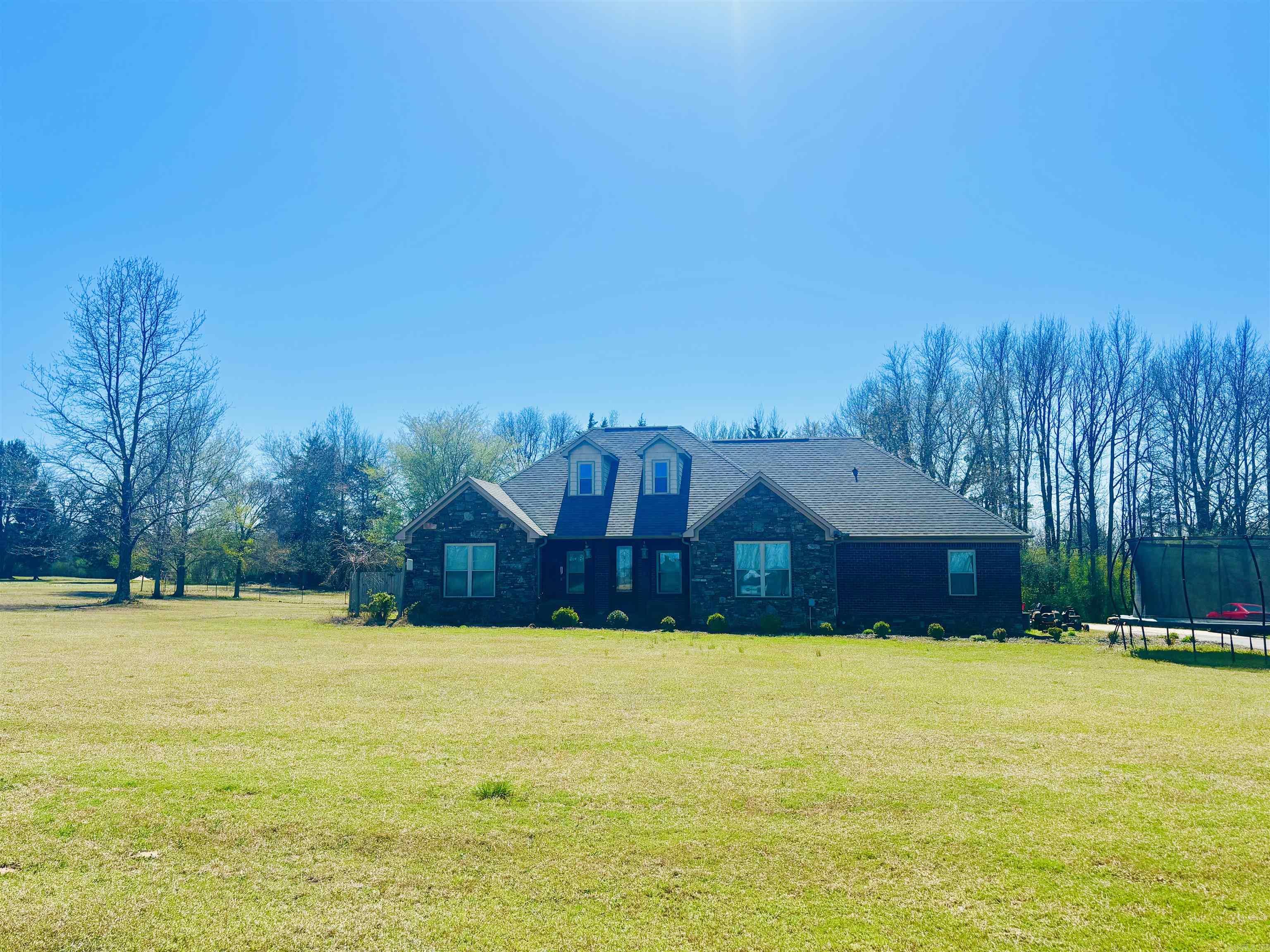 Nice! This beautiful 2 story home is conveniently located only a few minutes from Conway and Greenbrier with almost 3 gorgeous acres!  Enjoy 5 bedrooms, or 4 bedrooms with one as an office, 3 bathrooms, open concept living, dining, kitchen area with a gas log fireplace. The upstairs has a spacious bonus room perfect for a family or game room, den, or use as mother-in-law suite with a full bath and bedroom.  Stainless appliances, pantry, and breakfast bar, laundry and two car garage. The primary bedroom is apart with a huge walk-in closet with built-in shelving and private ensuite with both a jetted soaking tub and double walk-in tile shower with glass door. The back yard is privacy fenced and even comes with a chicken coop but privacy is no issue with a wooded buffer behind the property and a pasture area in front of the home. The setting and location are sure to appeal plus such a great layout for family living and plenty of space for outdoor living areas or a pool. This home is ready to come in, make a few updates, and make it your dream home. The home is also located in the Guy Perkins School District! Call today to view.