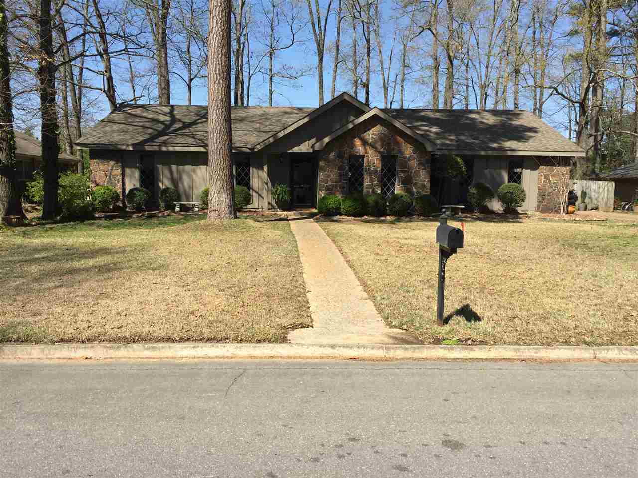 Stone and ceder home in excellent condition, close to everything. sprinkler system front  and back. extra landscaping. note;fire place is decorative.
