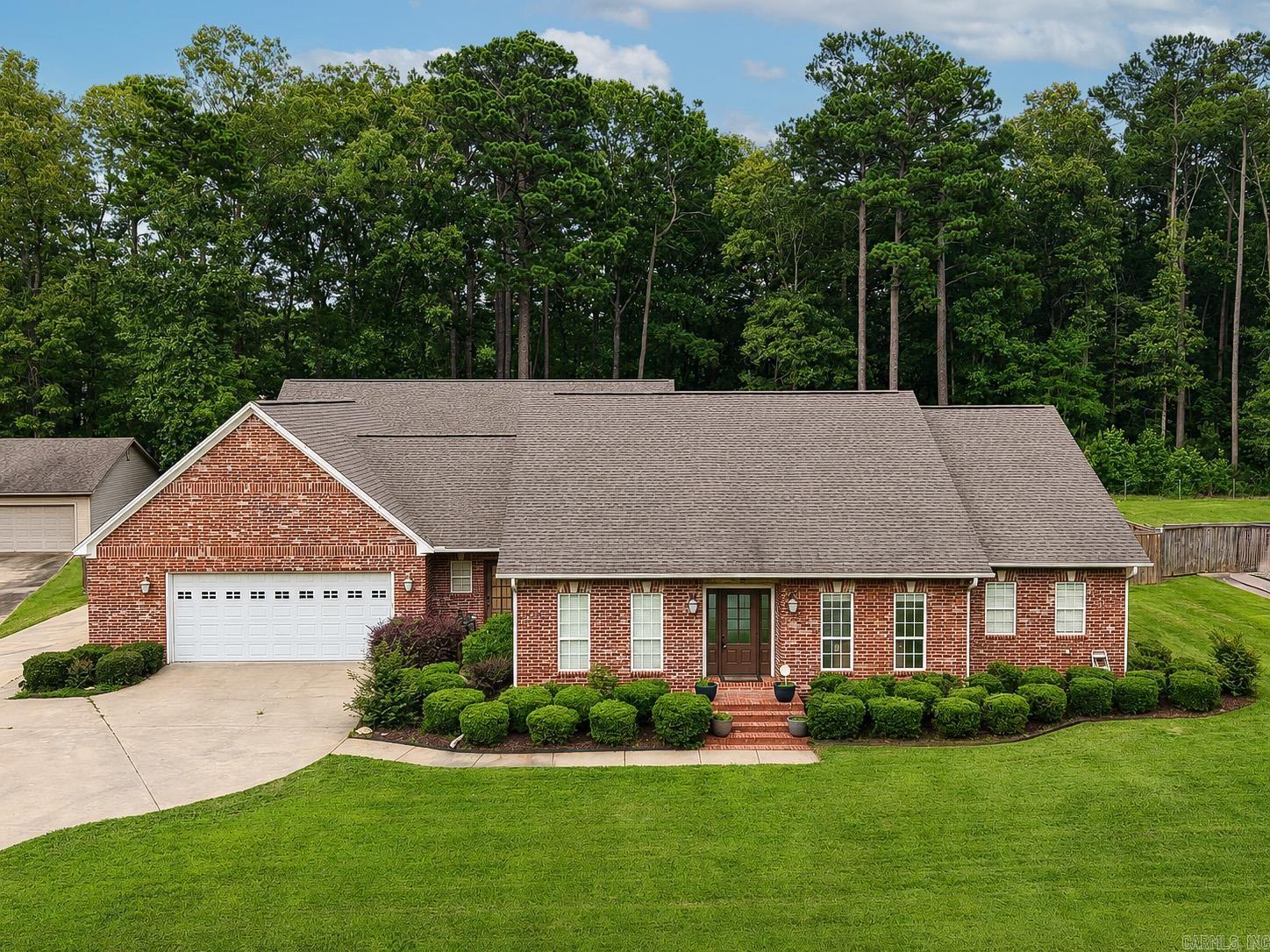 Welcome to this beautiful 3-bedroom, 3.5-bath brick home built in 1999, offering comfort, functionality, and exceptional outdoor amenities. Inside, you'll find spacious living areas and brand-new carpet in all bedrooms, providing a fresh and inviting feel throughout the home. Granite countertops, stainless steel appliances, a breakfast bar, and an inviting eating area  Step outside to your private backyard retreat featuring an L-shaped swimming pool installed in 2022, perfect for relaxing, entertaining, and enjoying warm summer days.  A standout feature of this property is the heated and cooled detached shop, designed for versatility and convenience. The shop includes a full kitchen and washer/dryer hookups, making it ideal for hobbies, entertaining, a home business, guest accommodations, or additional workspace. 60x40 900sq ft living space!!  The home is also equipped with a Generac whole-home generator, offering peace of mind and reliable backup power when needed.  This unique property combines quality construction, modern updates, and outstanding amenities, creating a rare opportunity for homeowners seeking both comfort and flexibility