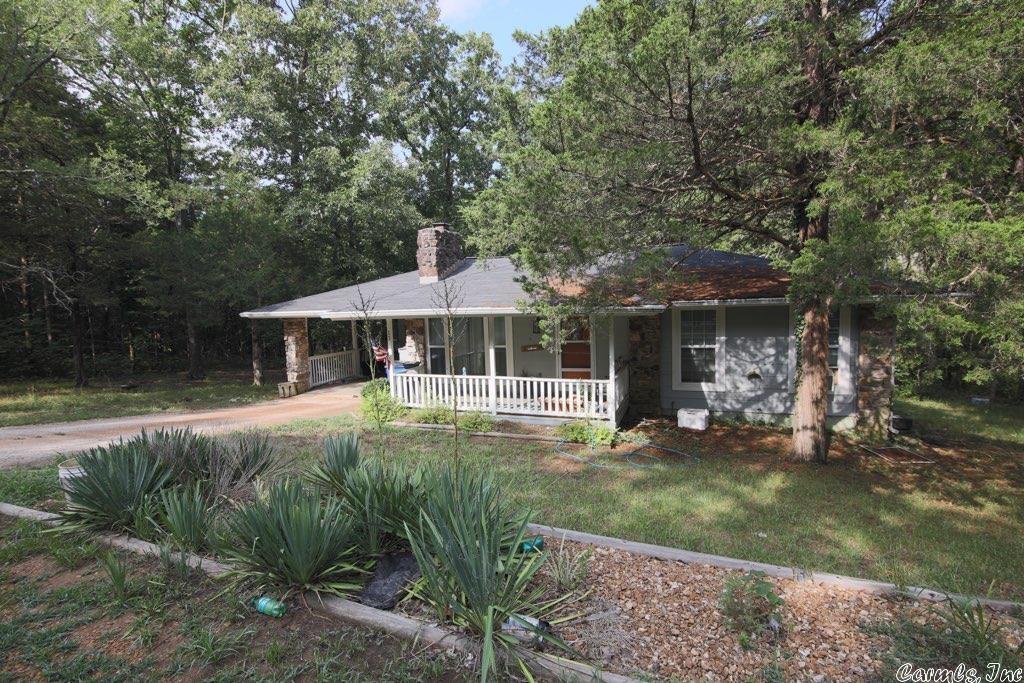 This country-style home in Cherokee Village sits on 7 wooded lots, surrounded by wildlife. The 2 bedroom, 2 bathroom property has a 1-car attached carport, large back deck, covered front porch and open-concept main living. This location is perfect with access to pools, gyms, mini golf, discounts on golf and more (fees are associated with activities). Call for your showing of this home in town.