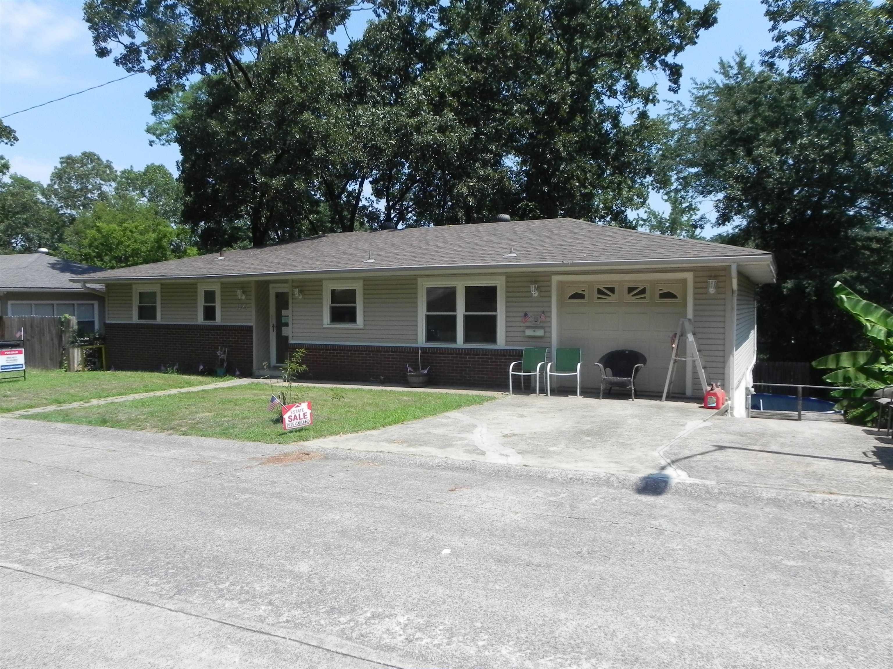 This Rare find in a desired area overlooking one of the three Lakewood Lakes. Original owners since 1957 have made many updates.  Large kitchen with lots of updates two double ovens (owner was known as the cake lady).  Nice eat in area on main level, newer windows, den-with a view of the lake. Three bedrooms & full bath and half on main level.   Den with fireplace, office and hobby area, & 1 bedroom all downstairs.   Basement with laundry area plus tons of storage.  Home has great potential but needs to be updated.  At this price you can make it your own style. One car garage with room on the side for extra car, boat, etc.  GREAT CURB APPEAL .House is vacant with most items from the estate sale and is ready for new owners .