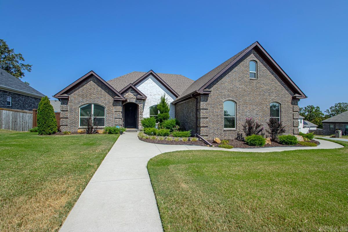 Welcome to this beautiful all brick home! Meticulously taken care of! Walk through the front door to find fabulous wood floors! Dining room has coffered ceiling, intrigue moldings on the walls, arched doorways & plantation shutters! Roomy family room w/ vault ceilings & a cozy fireplace! Well appointed eat in kitchen w/ granite countertops & pretty backsplash! Room enough for all the chefs! Pantry! Split bedroom plan. All bedrooms are large w/big closets! Primary offers a spa bath & a closet to get lost in! Small desk/makeup cubby in closet is a surprise bonus! Bonus room up stairs! Great for flex space!  This home sits on a corner lot w/side load garage! Front has sprinkler system. Stained fencing offers privacy for cookouts & parties in the back yard! Covered back porch, a pretty pergola & storage building! Welcome Home! See agent remarks..