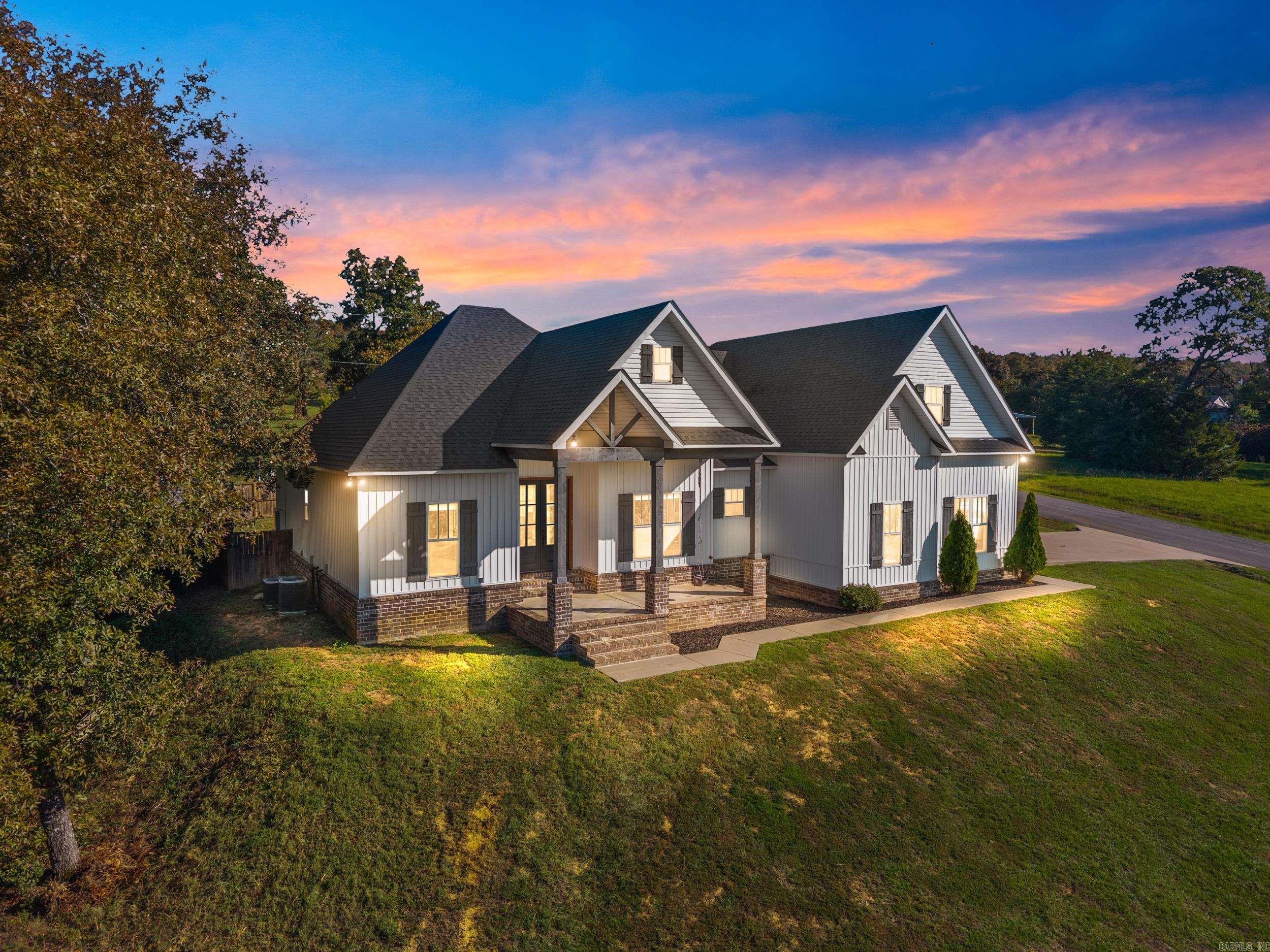 Remodeled with Breathtaking Views on 2 Acres! This beautiful 4-bedroom, 3-full bath custom built home offers style, comfort, and breathtaking views! Step inside to a desirable open, split floorplan with 3 bedrooms and 2 baths down, plus a private guest suite with full bath upstairs. The open-concept design features high ceilings, a spacious living area, dining and breakfast area, and a chef’s kitchen with a large island, granite countertops, walk-in pantry, and separate coffee bar. The primary ensuite is its own retreat with a soaking tub, separate shower, dual sinks with granite countertops and a huge walk-in closet that’s conveniently connected to the laundry room. Outside, enjoy peaceful mornings on the front porch with stunning view or a relaxing evening on the back covered porch overlooking the large fenced in backyard. With space to entertain indoors or out, this home blends modern upgrades with country charm! Recent updates include NEW carpet, LVP flooring and interior paint downstairs (2026), NEW roof (2022) and fenced backyard (2021). Plenty of parking space with the oversized two car garage and lots of storage space in the floored attic. Fiber internet available too.